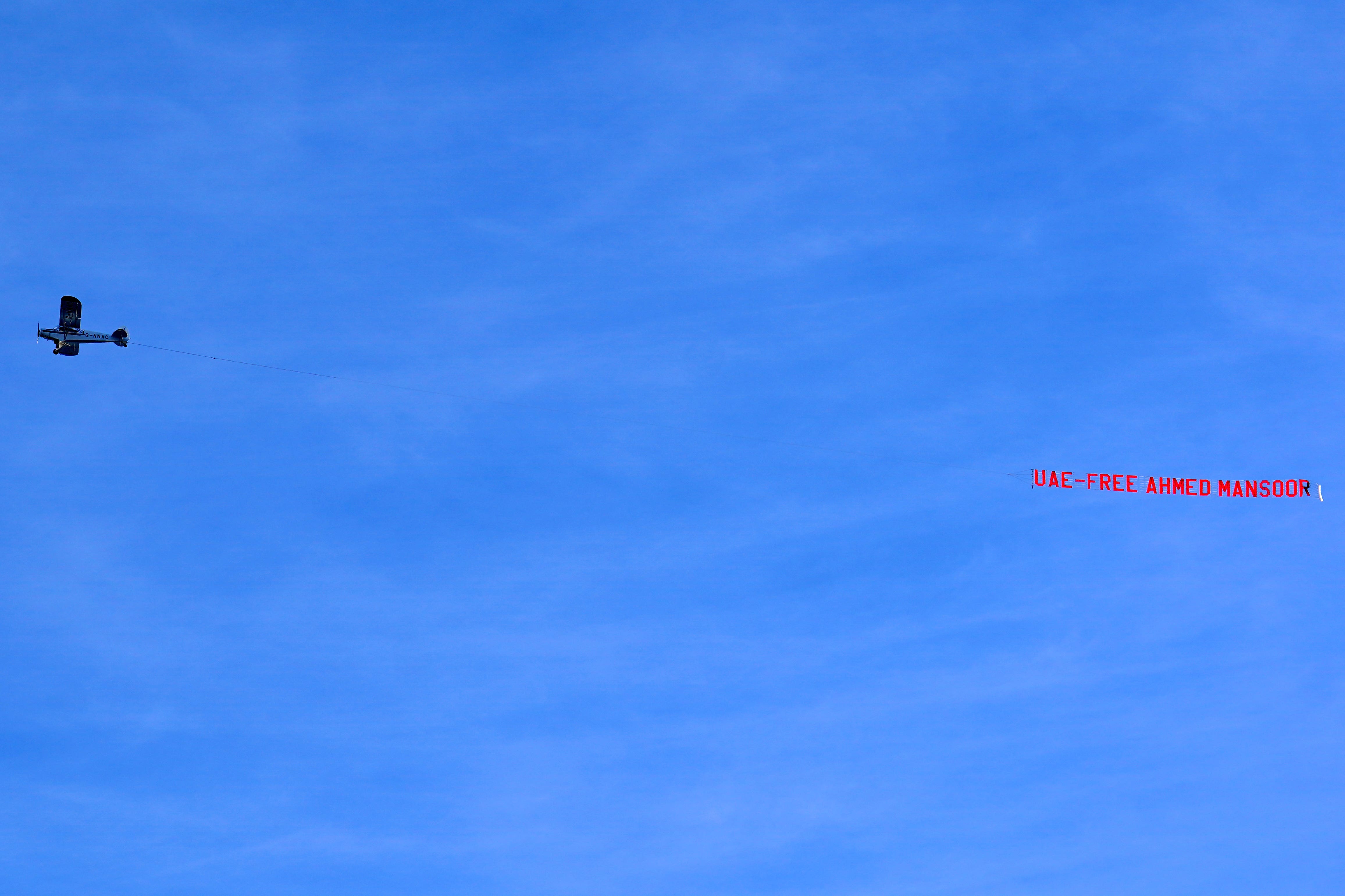 A plane, organised by Amnesty International UK campaigners, carrying a banner reading ‘UAE: Free Ahmed Mansoor’ flies over the Etihad Stadium (Martin Rickett/PA)