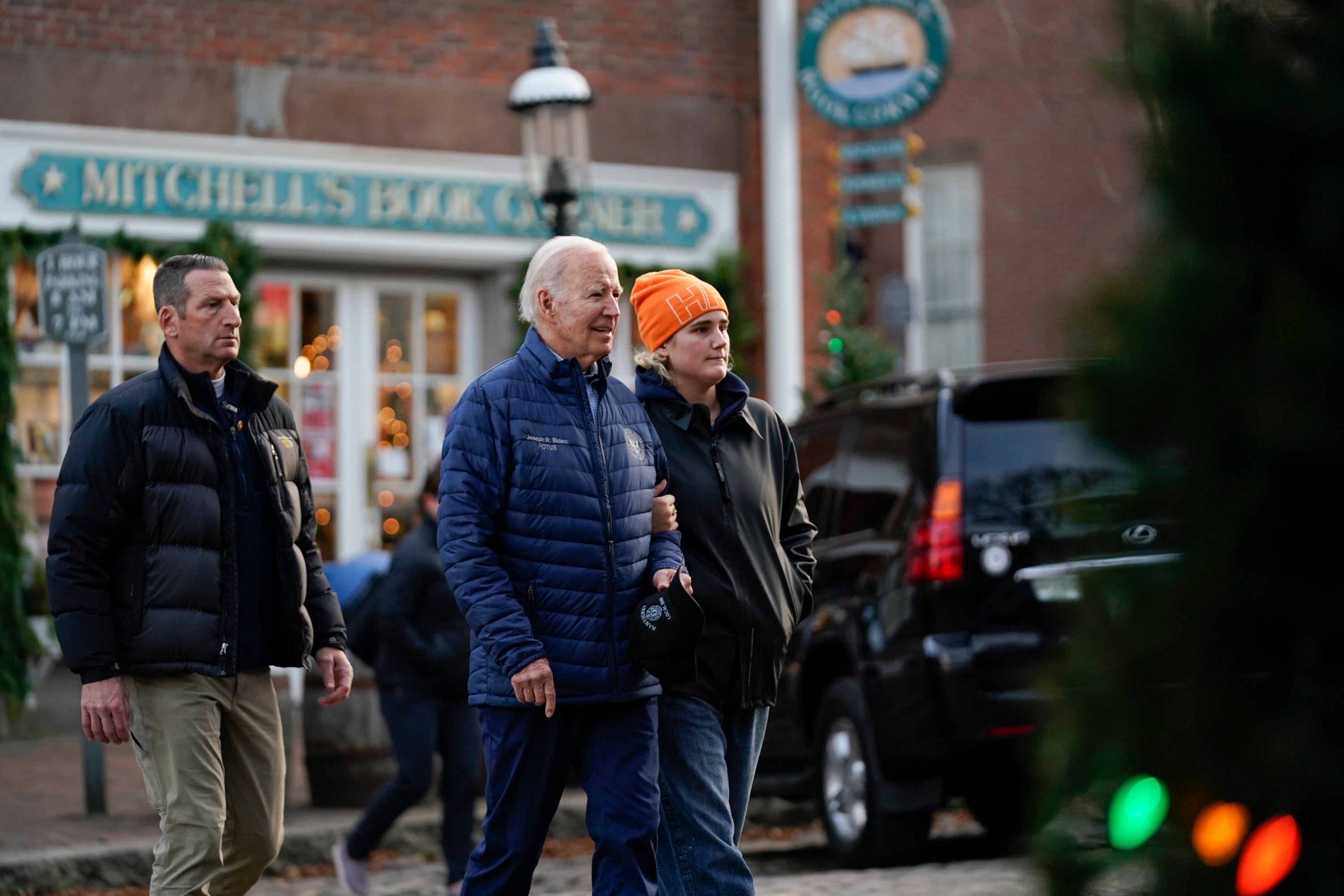 President Joe Biden walks with his granddaughter Maisy Biden as he visits local shops with family in Nantucket