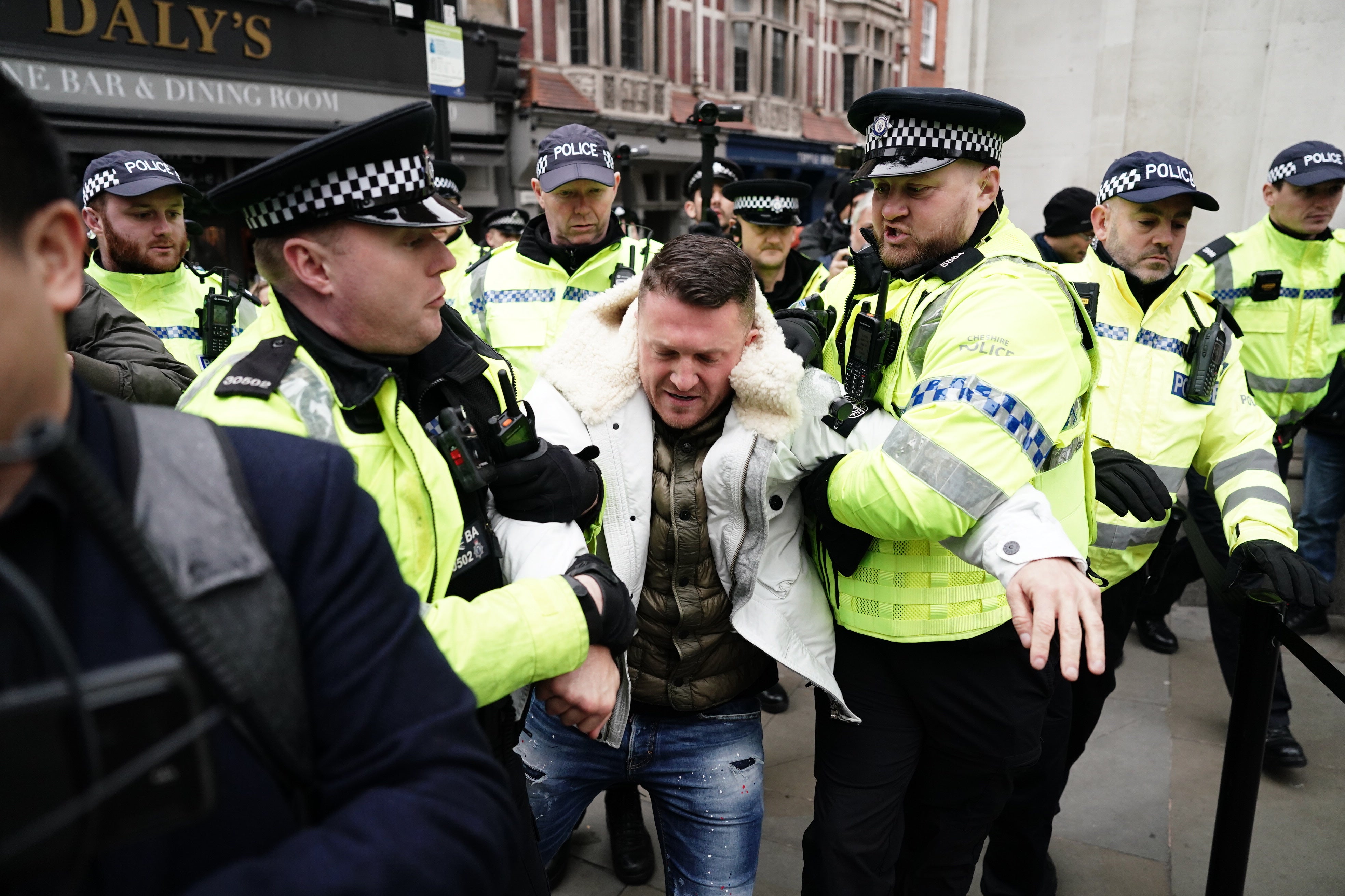 Tommy Robinson escorted away by police