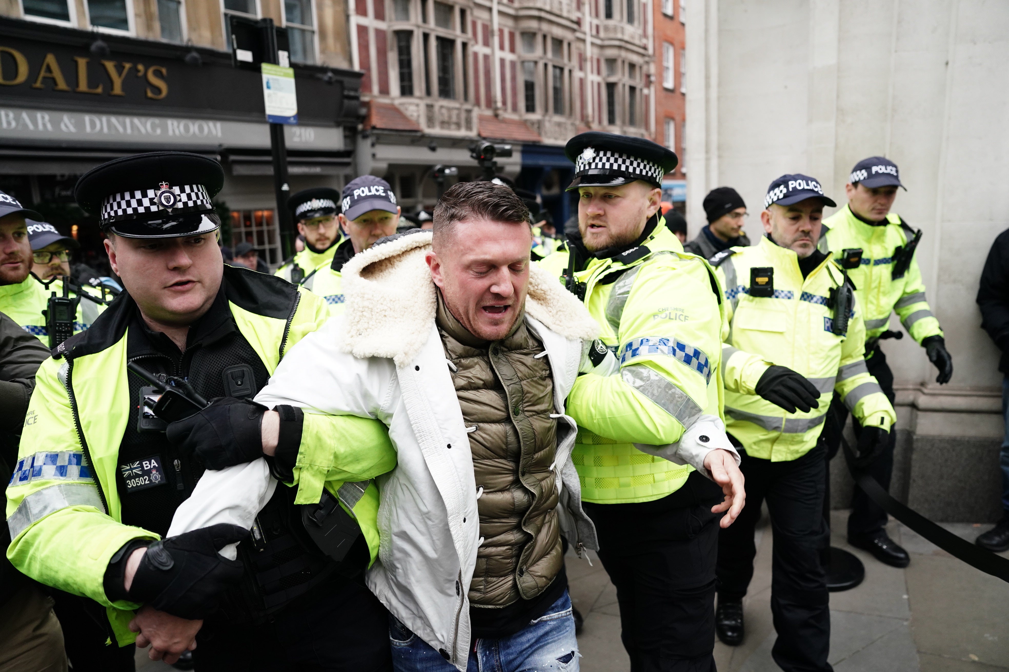 The EDL founder was escorted away from the march