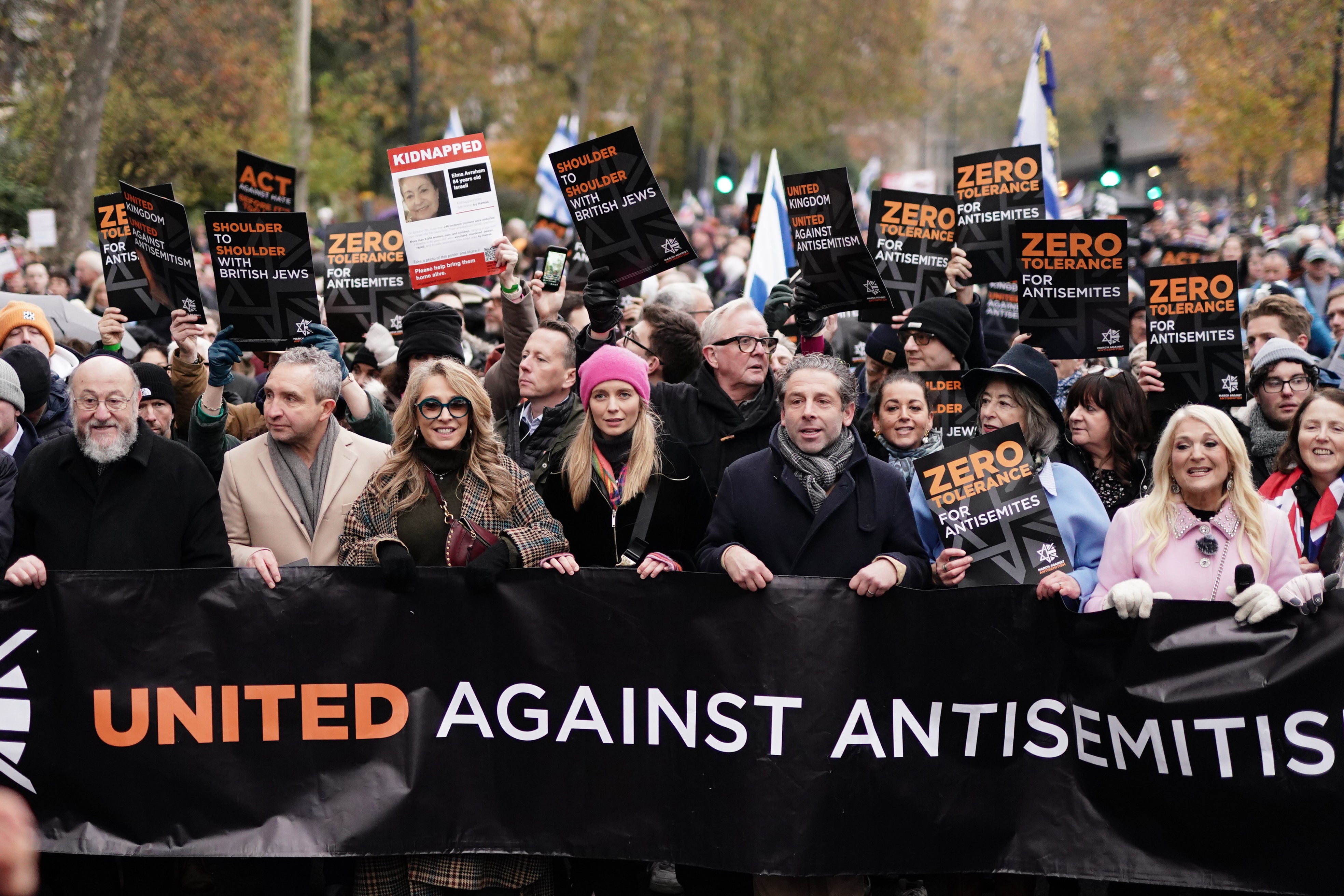 Many attended holding antisemitism placards, hostage posters and Israel flags as attendees chanted 'bring them home’