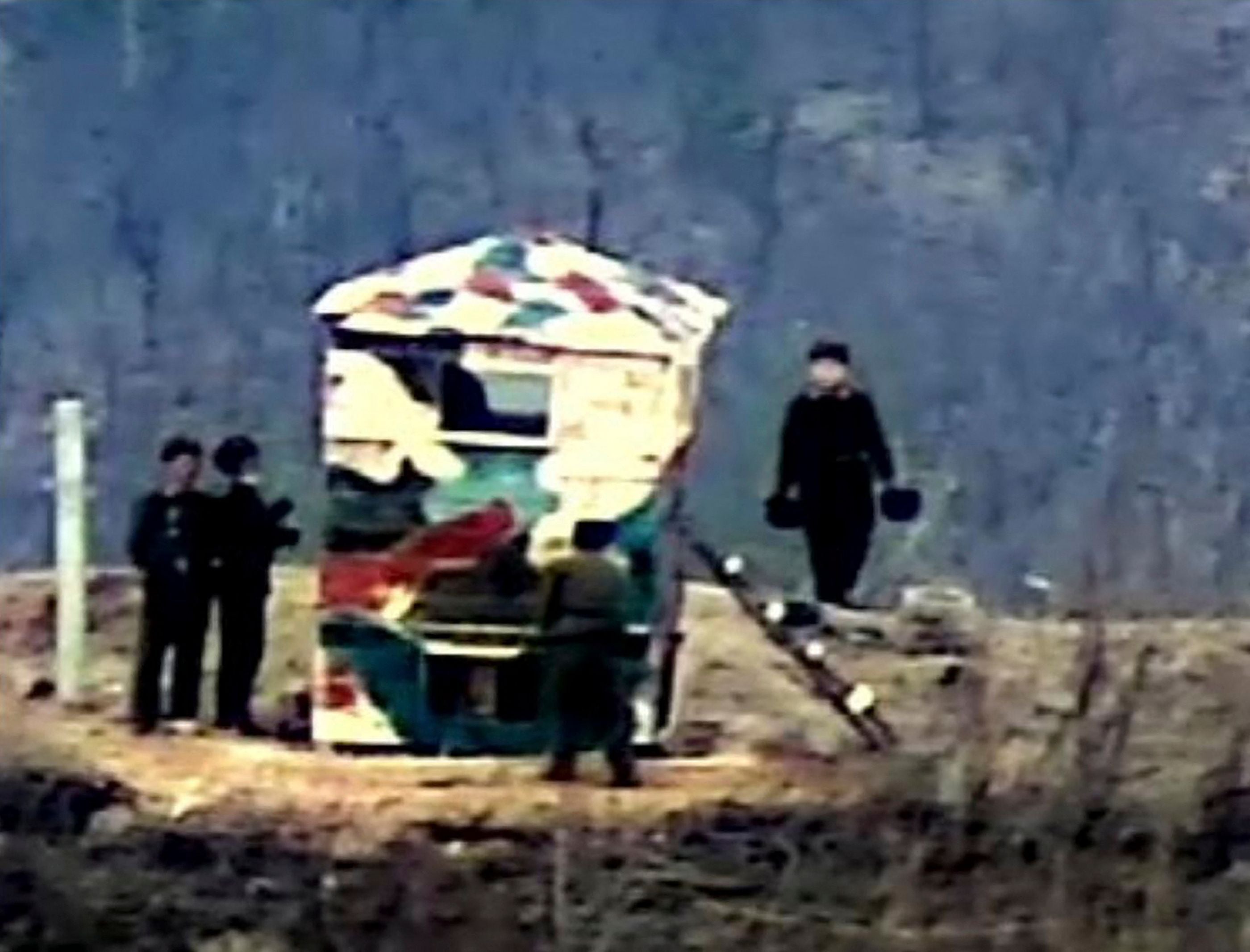 South Korean Defence Ministry shows North Korean soldiers rebuilding a guard post on the North side of the Demilitarised zone (DMZ) dividing the two Korea