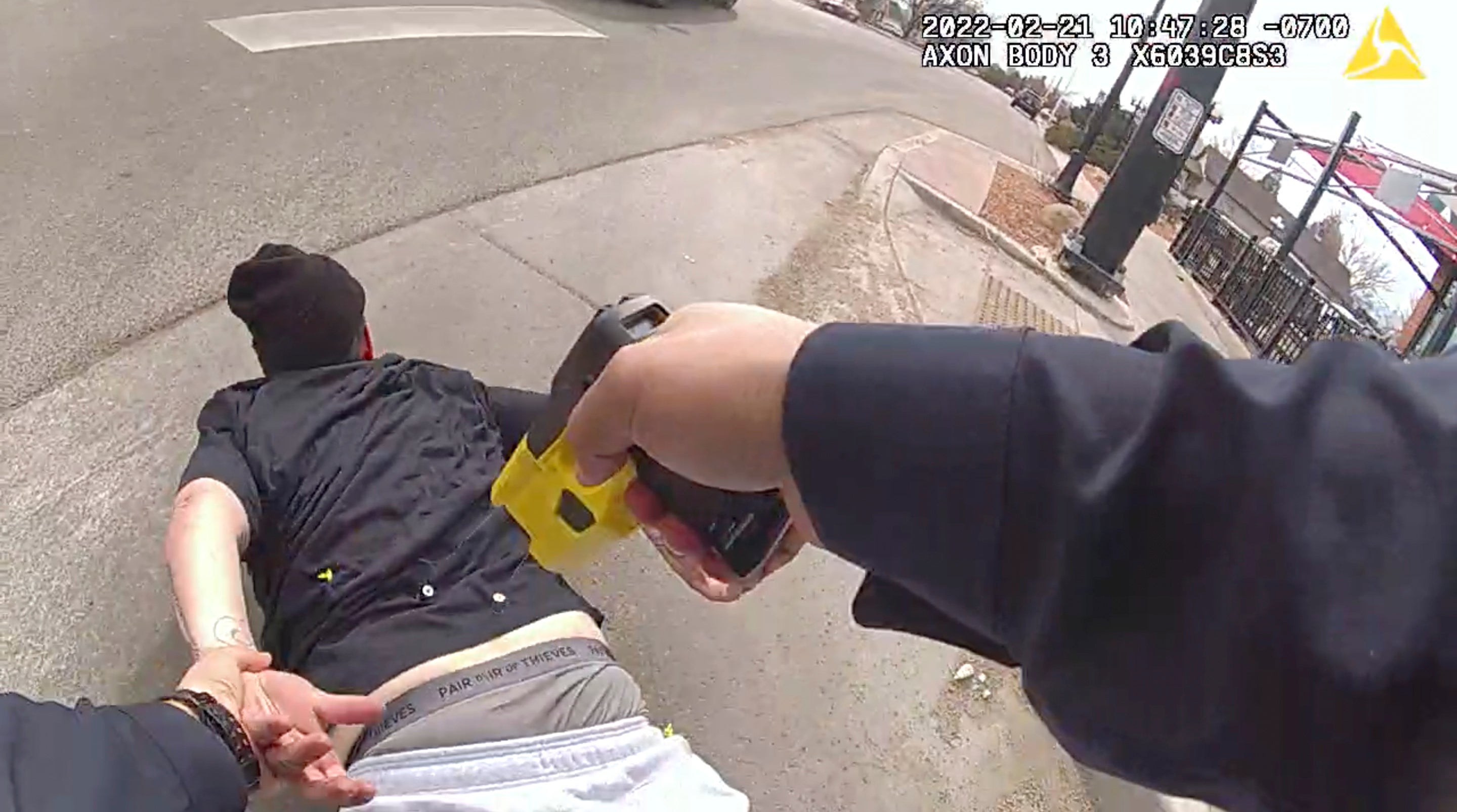 In this frame grab taken from Pueblo Police Department body camera video and provided by attorney Kevin Mehr, representing Cristy Gonzales, Pueblo police Cpl. Bennie Villanueva deploys his Taser into Gonzales' back as she lies on the ground during an arrest, in Pueblo, Colorado. Conzales is suing the officer for excessive force.