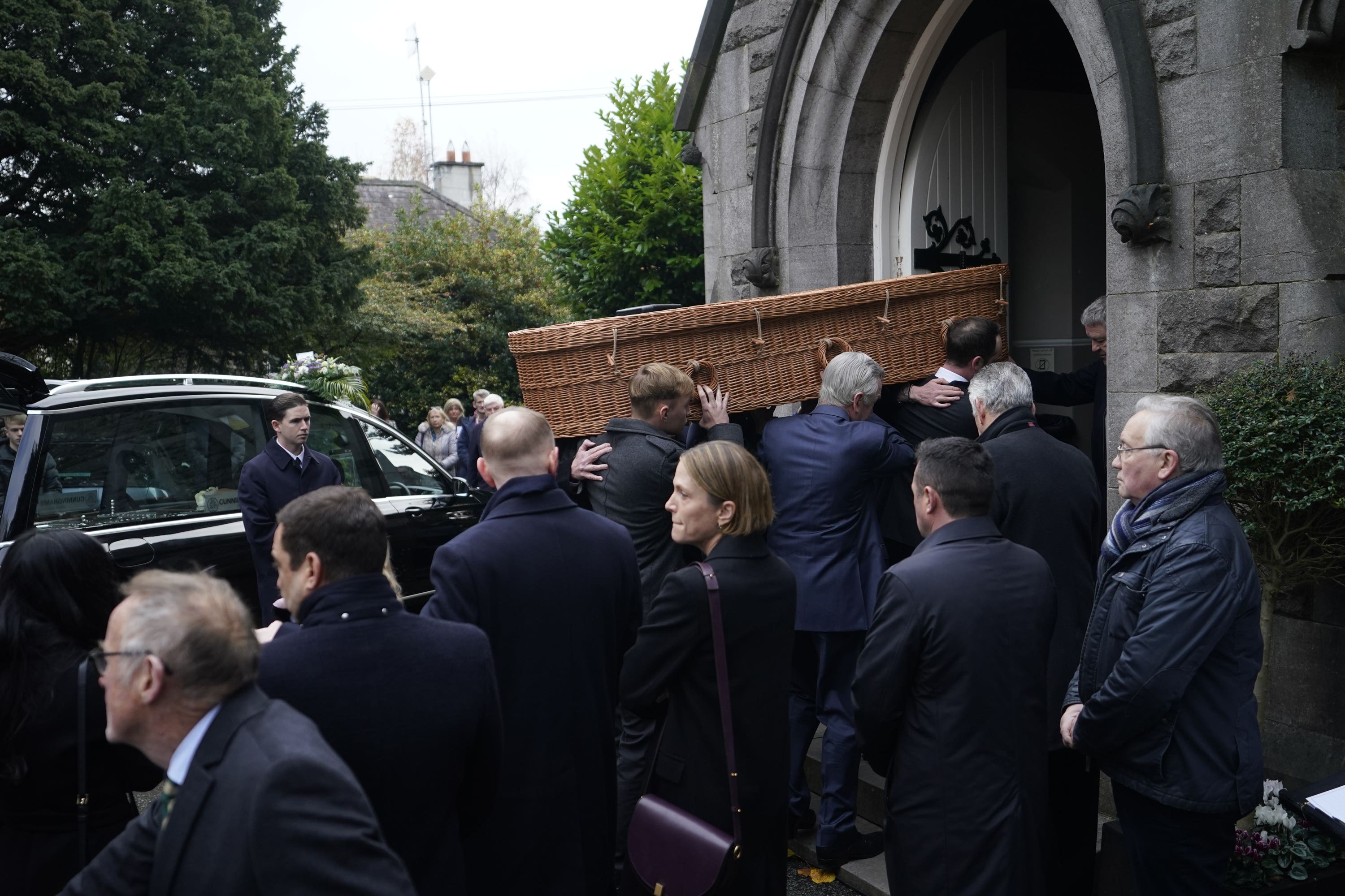 Ben Dunne’s casket is carried in to St Mochta’s church in Clonsilla, west Dublin for his funeral service. Mr Dunne, 74, who was the former director of family business Dunnes Stores and the owner of a chain of gyms, died last week while holidaying in Dubai. Picture date: Tuesday November 28, 2023.