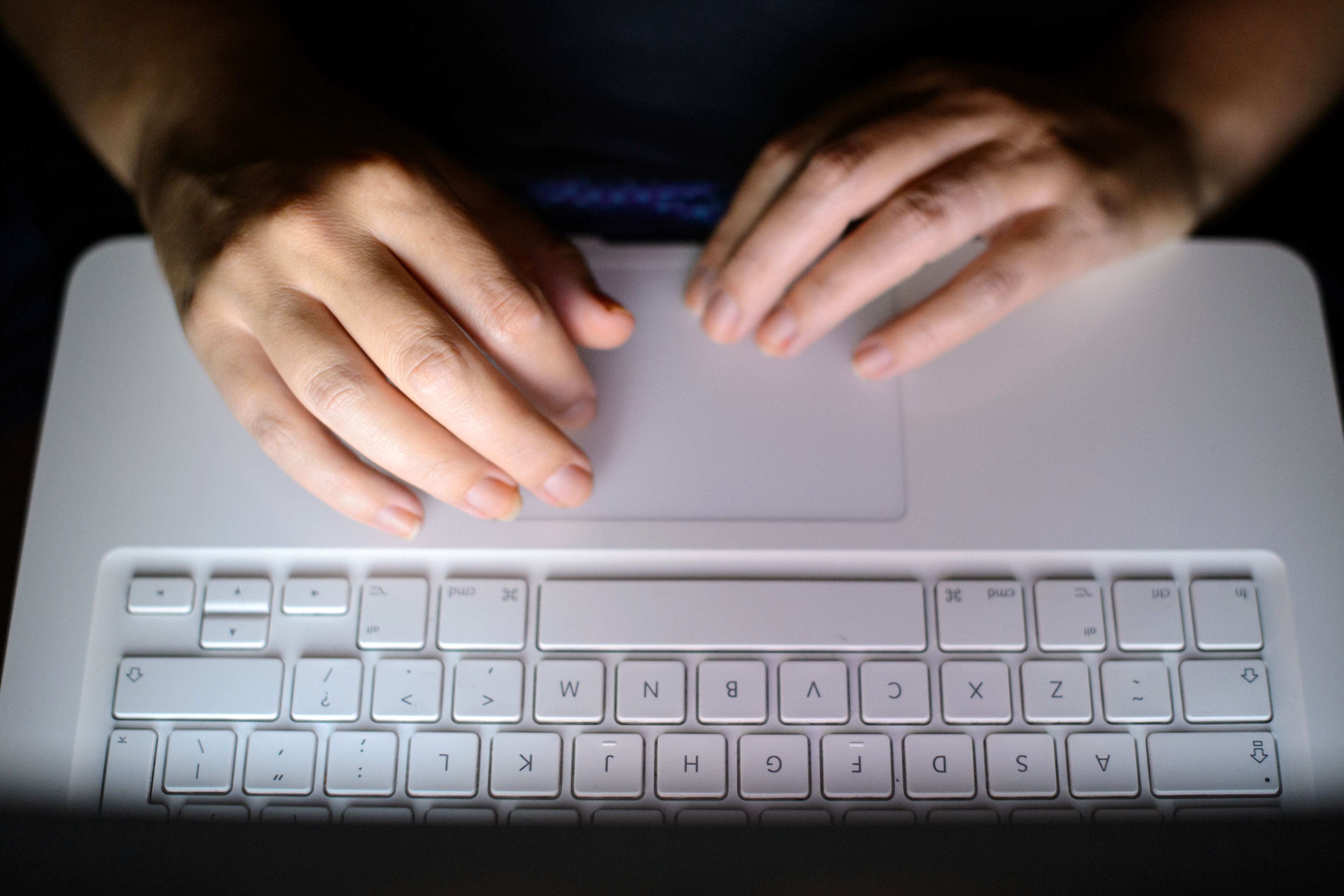 A woman’s hands using a laptop keyboard (Dominic Lipinski/PA)