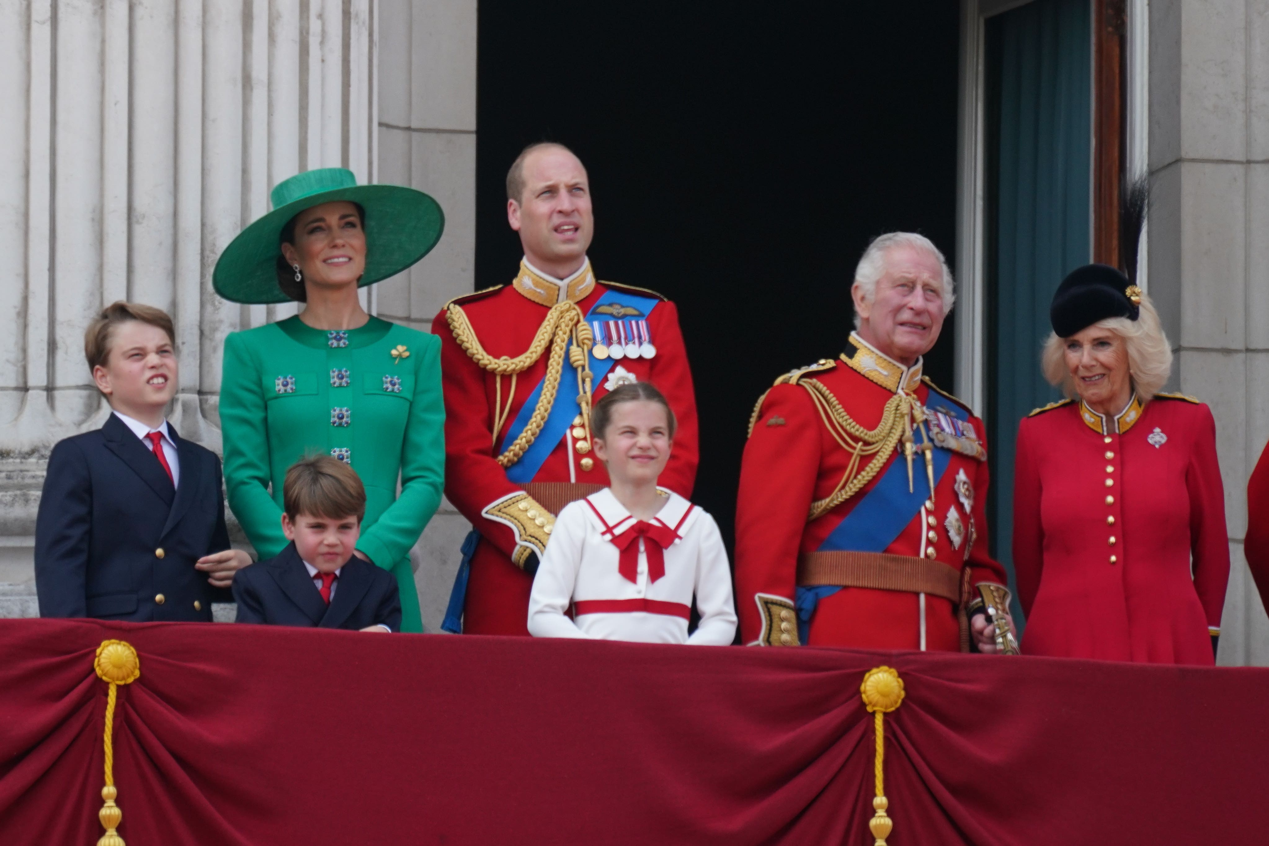 From left: Prince George, the Princess of Wales, Prince Louis, the Prince of Wales, Princess Charlotte, King Charles III and Queen Camilla on the balcony of Buckingham Palace (PA)