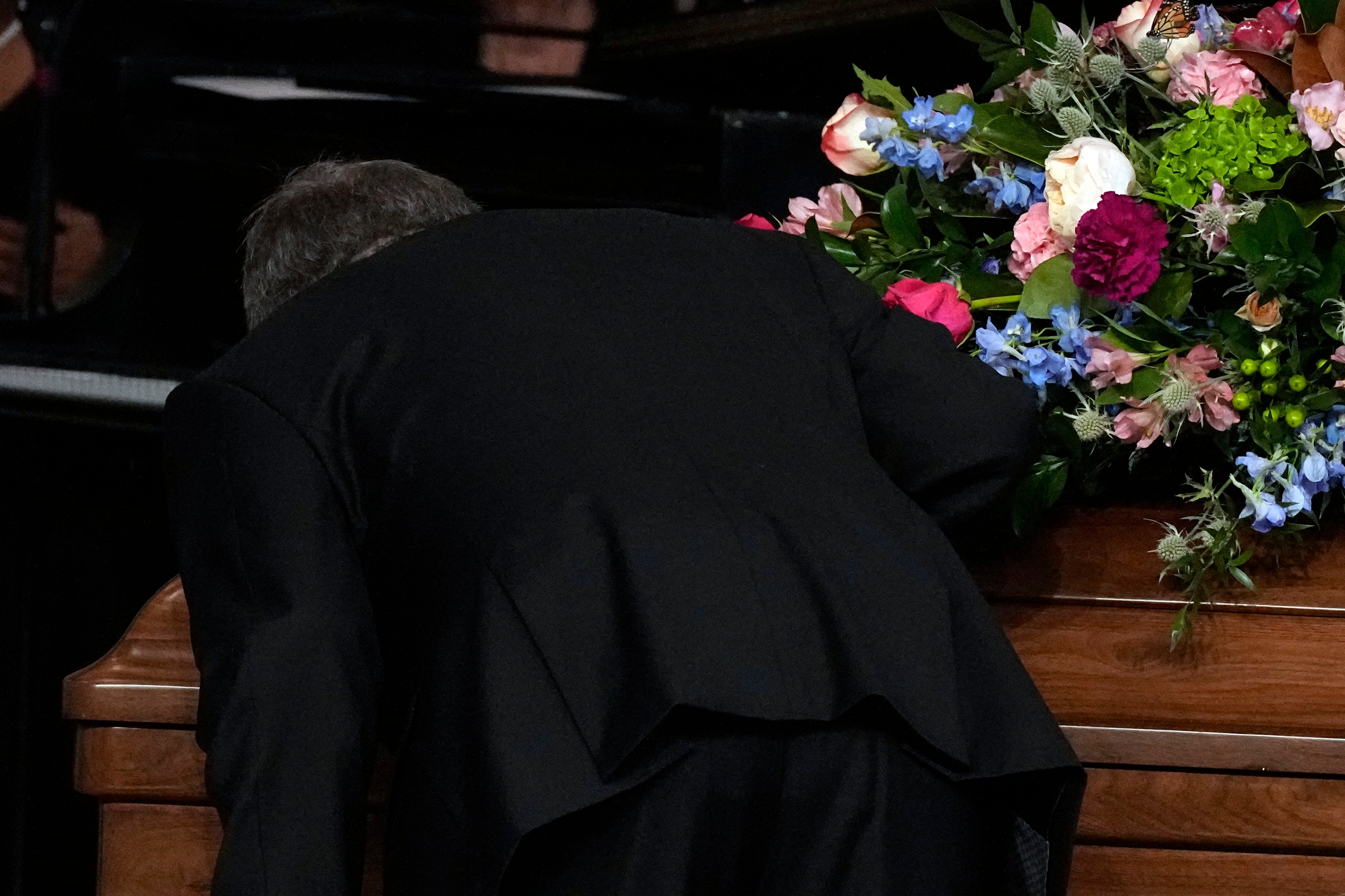 James "Chip" Carter kisses the casket of his mother, former first lady Rosalynn Carter, during a tribute service at Glenn Memorial United Methodist Church on November 28, 2023