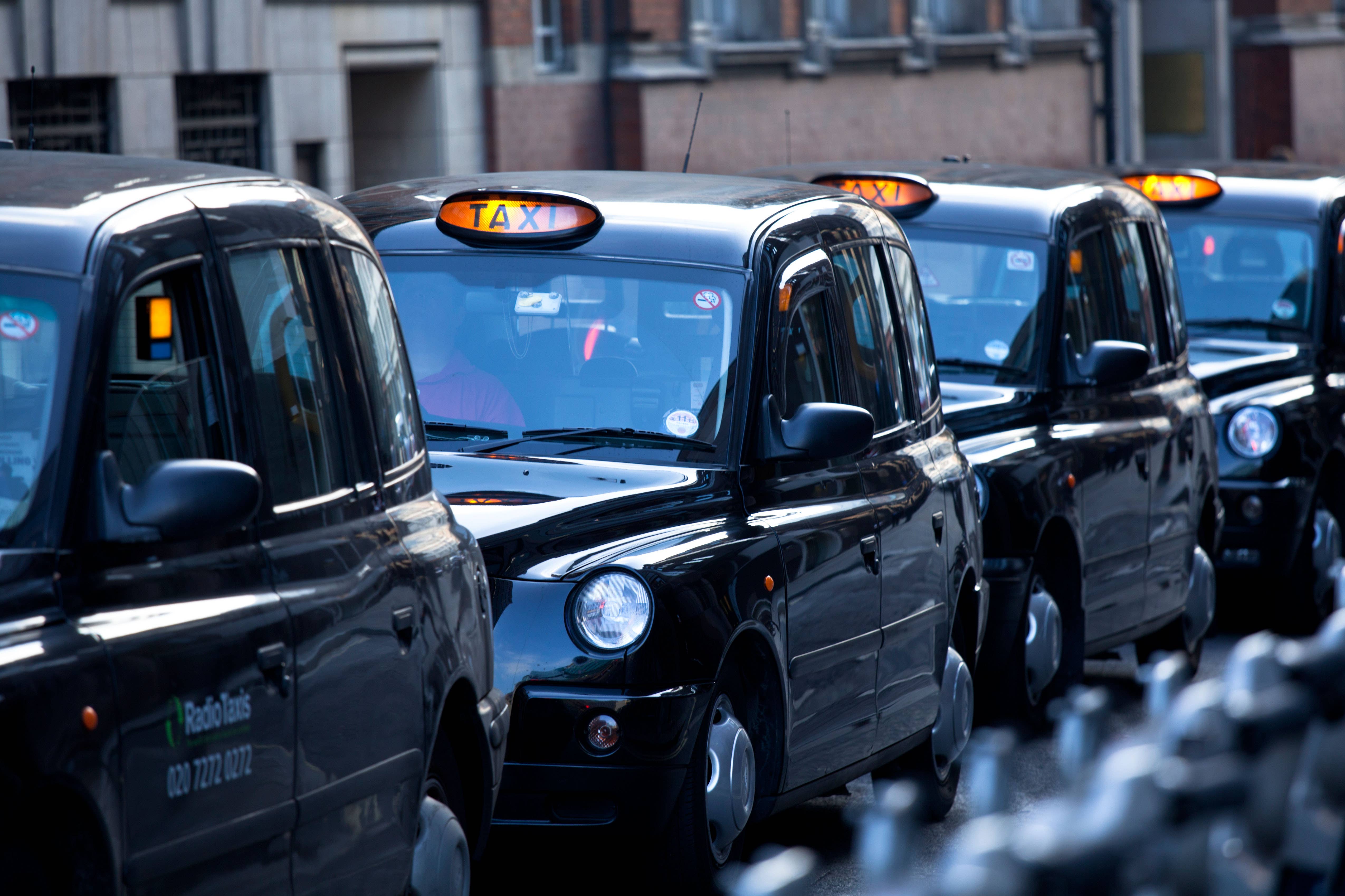 People in London will be able to order black cabs through Uber from early next year, the app company has announced (Alamy/PA)