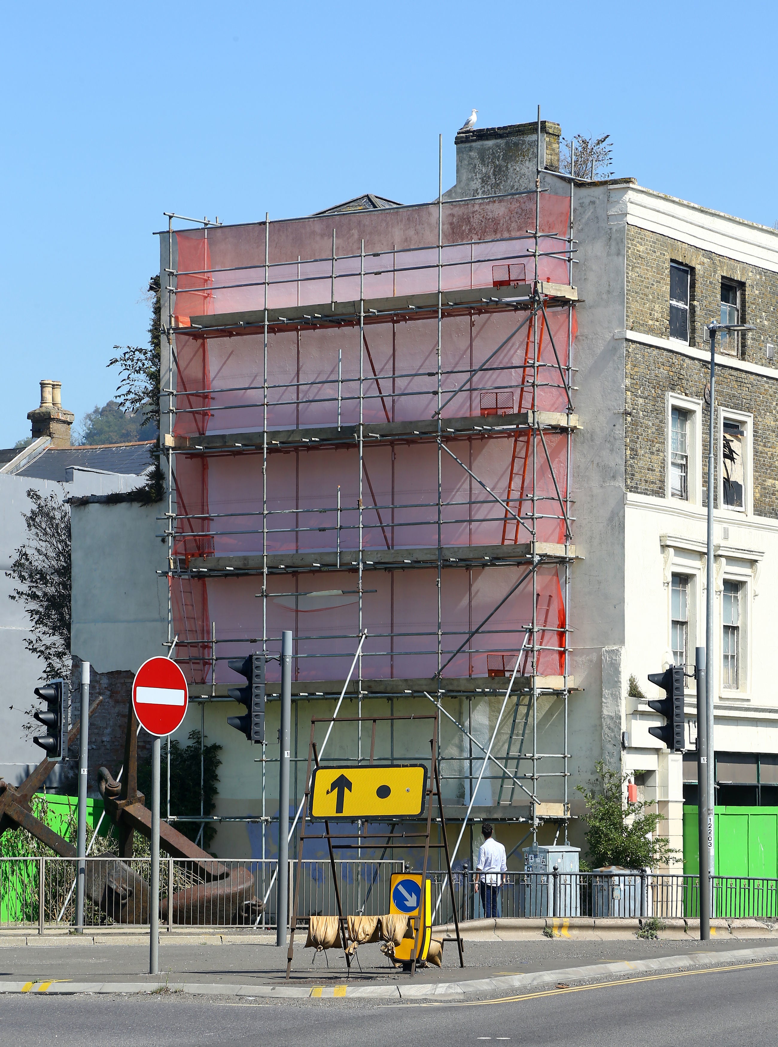 The painting was hidden by paint and scaffolding