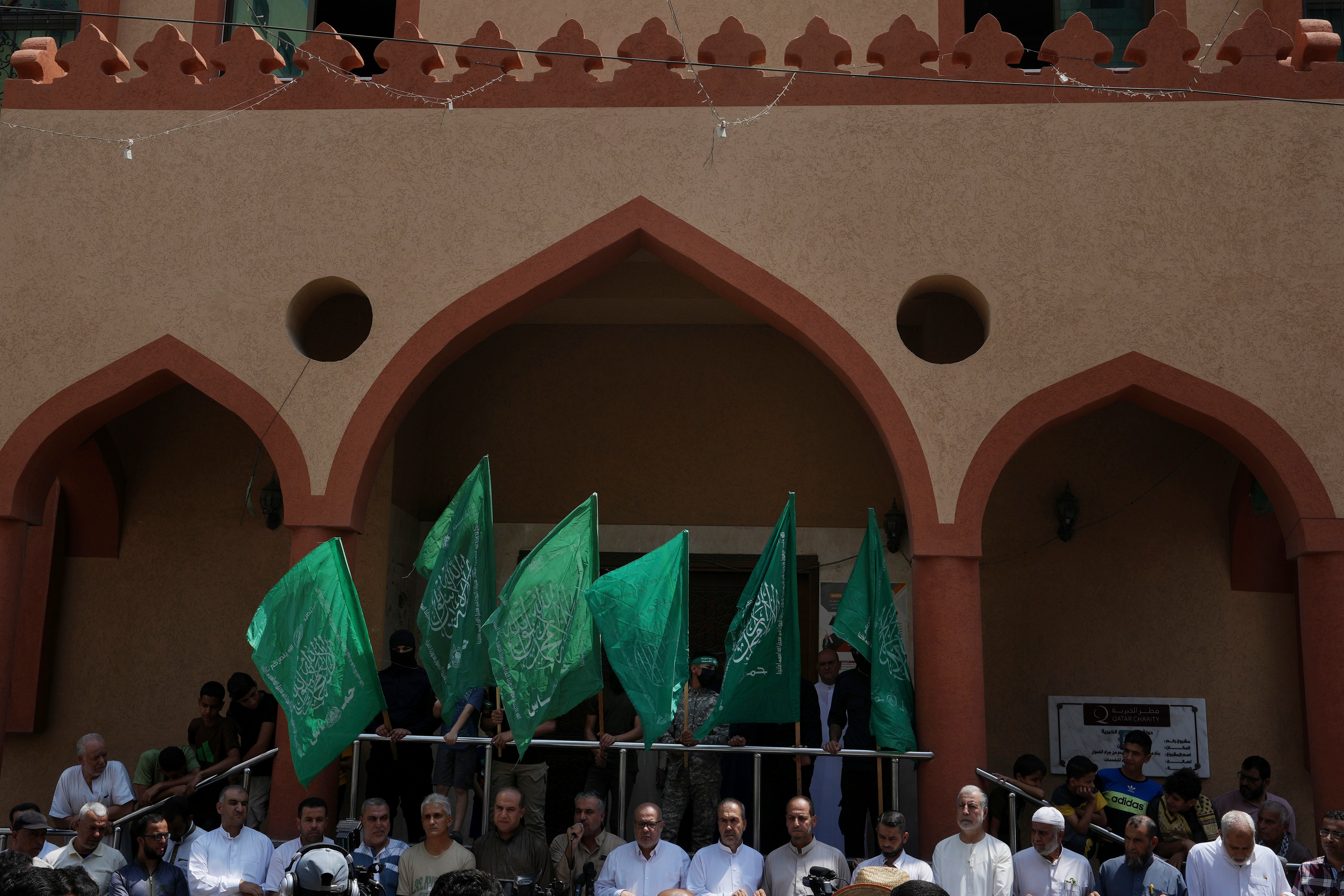 Hamas militants wave the green flags of the Islamist group during a protest in support of Palestinian prisoners in Israeli jails in Nusseirat refugee camp, central Gaza Strip, weeks before they attacked Israel on 7 October