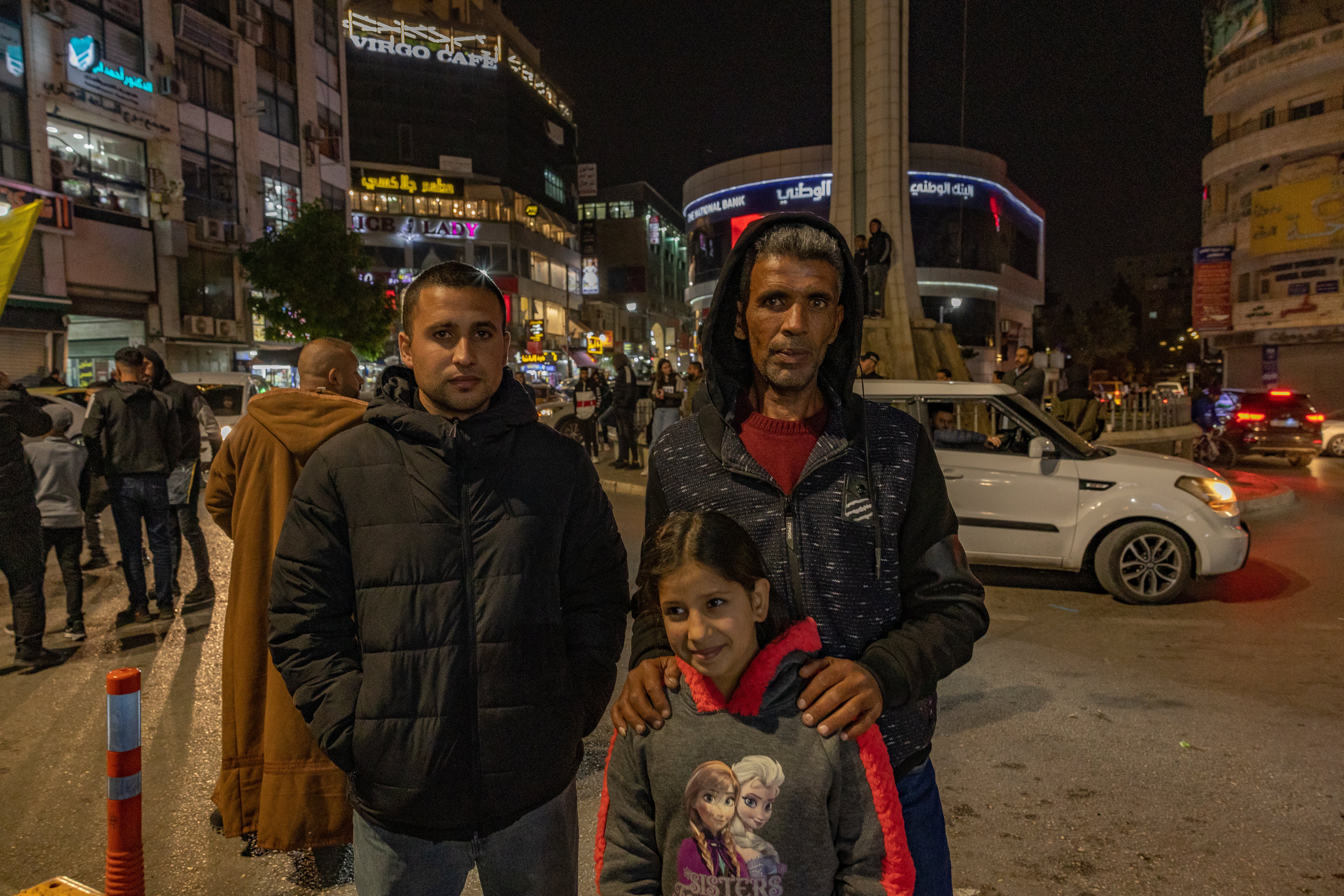 Obada's family waiting anxiously by a main roundabout in Ramallah for him to be released from prison