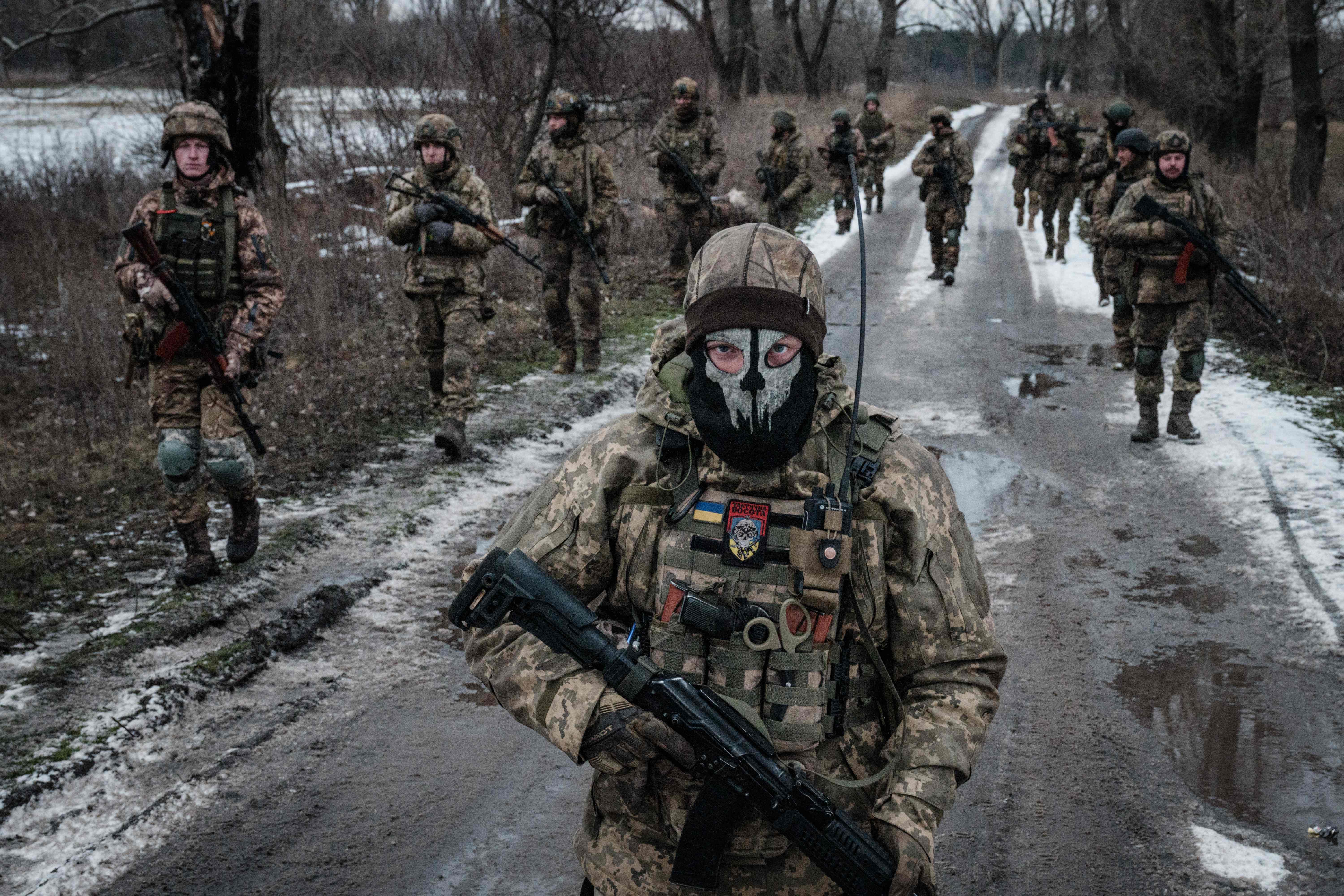 krainian servicemen walk on the road toward their base near the frontline in the Donetsk region on 4 February