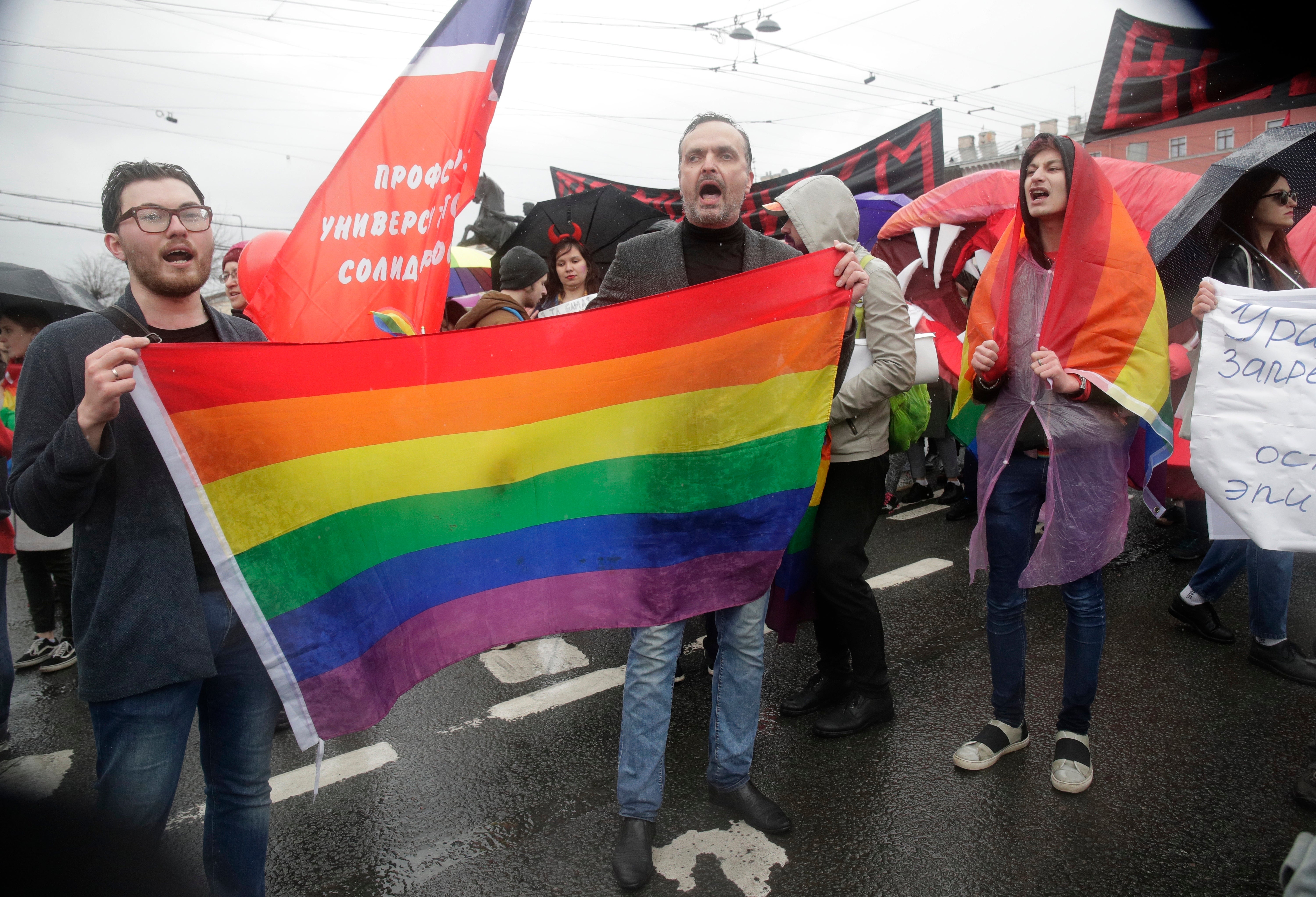 Advocate and founder of the Russian LGBT Network rights group Igor Kochetkov, center, and other activists in Russia