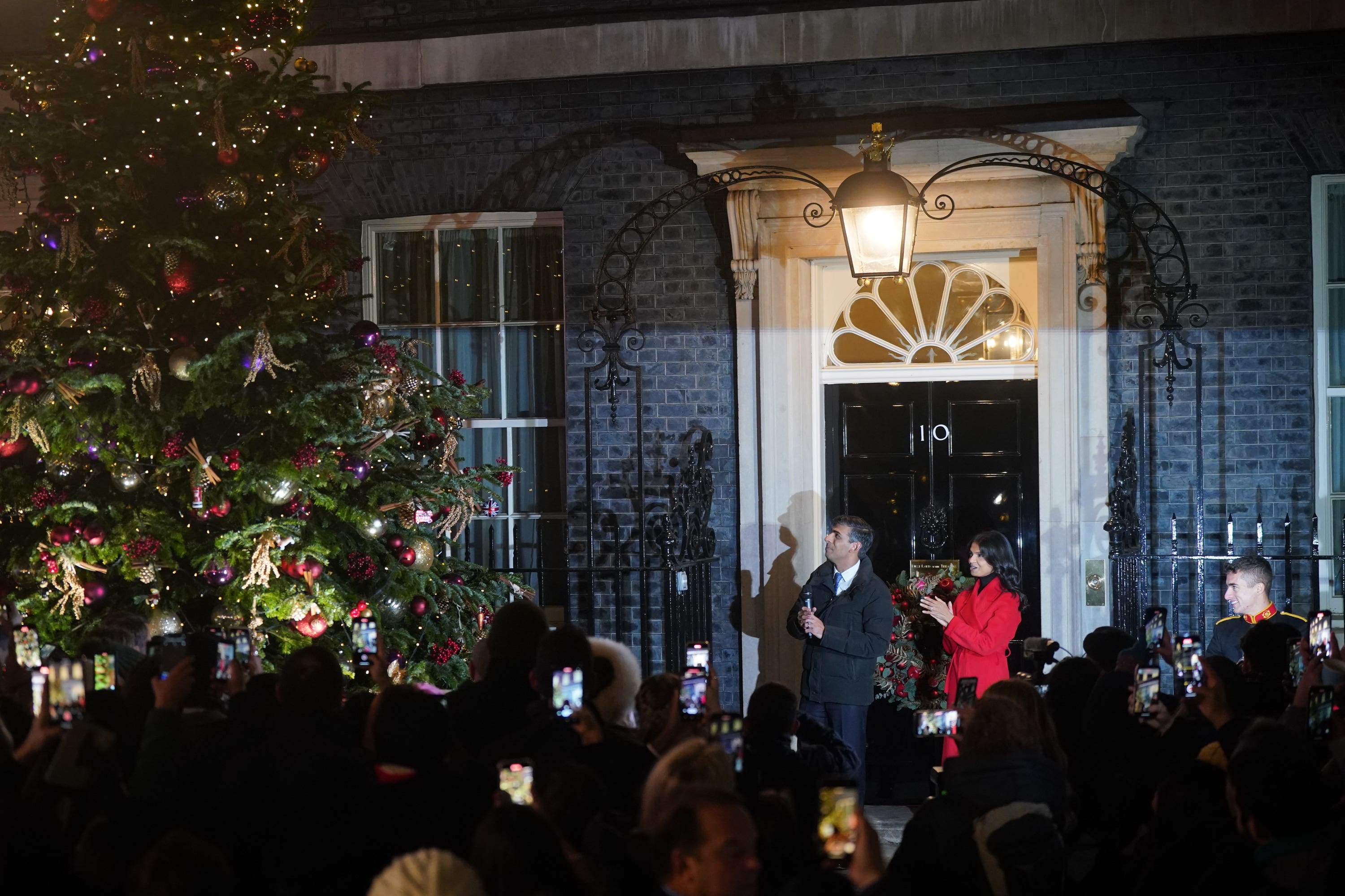 Prime Minister Rishi Sunak and his wife Akshata Murty, at the switching on of the Downing Street Christmas tree lights in London (Victoria Jones/PA)