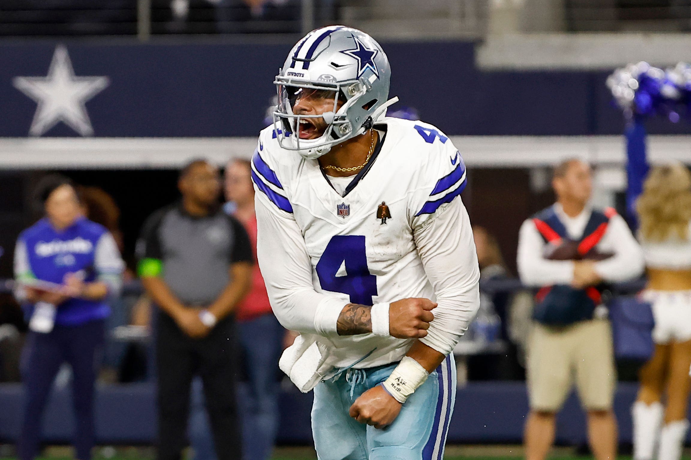 Dallas Cowboys quarterback Dak Prescott (4) celebrates after throwing a pass to Brandin Cooks for a two-point conversion against the Seattle Seahawks (Roger Steinman/ AP)