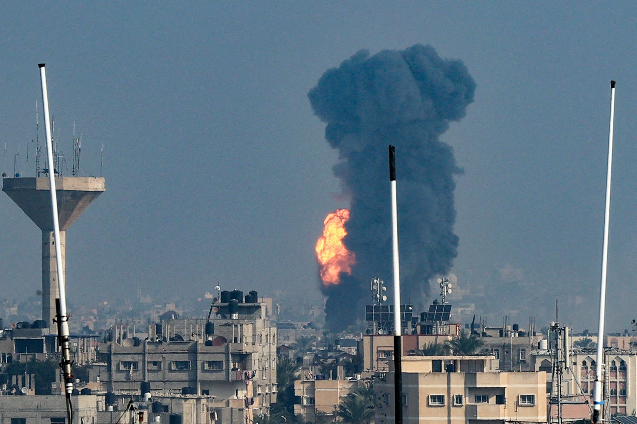 Smoke rises above buildings during an Israeli strike on Rafah in the southern Gaza Strip on Friday