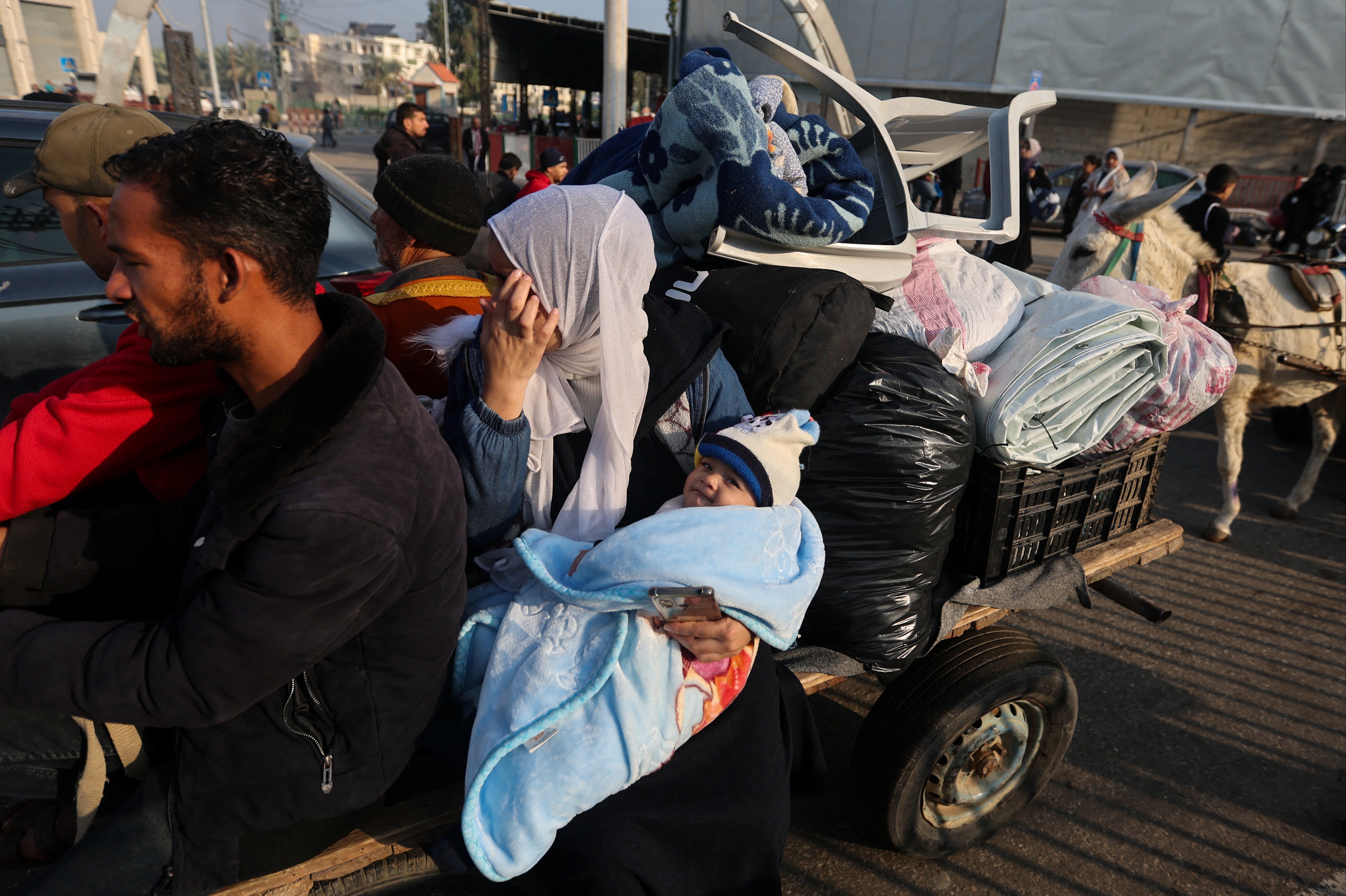 Palestinians flee their houses and head south after airstrikes across Khan Younis