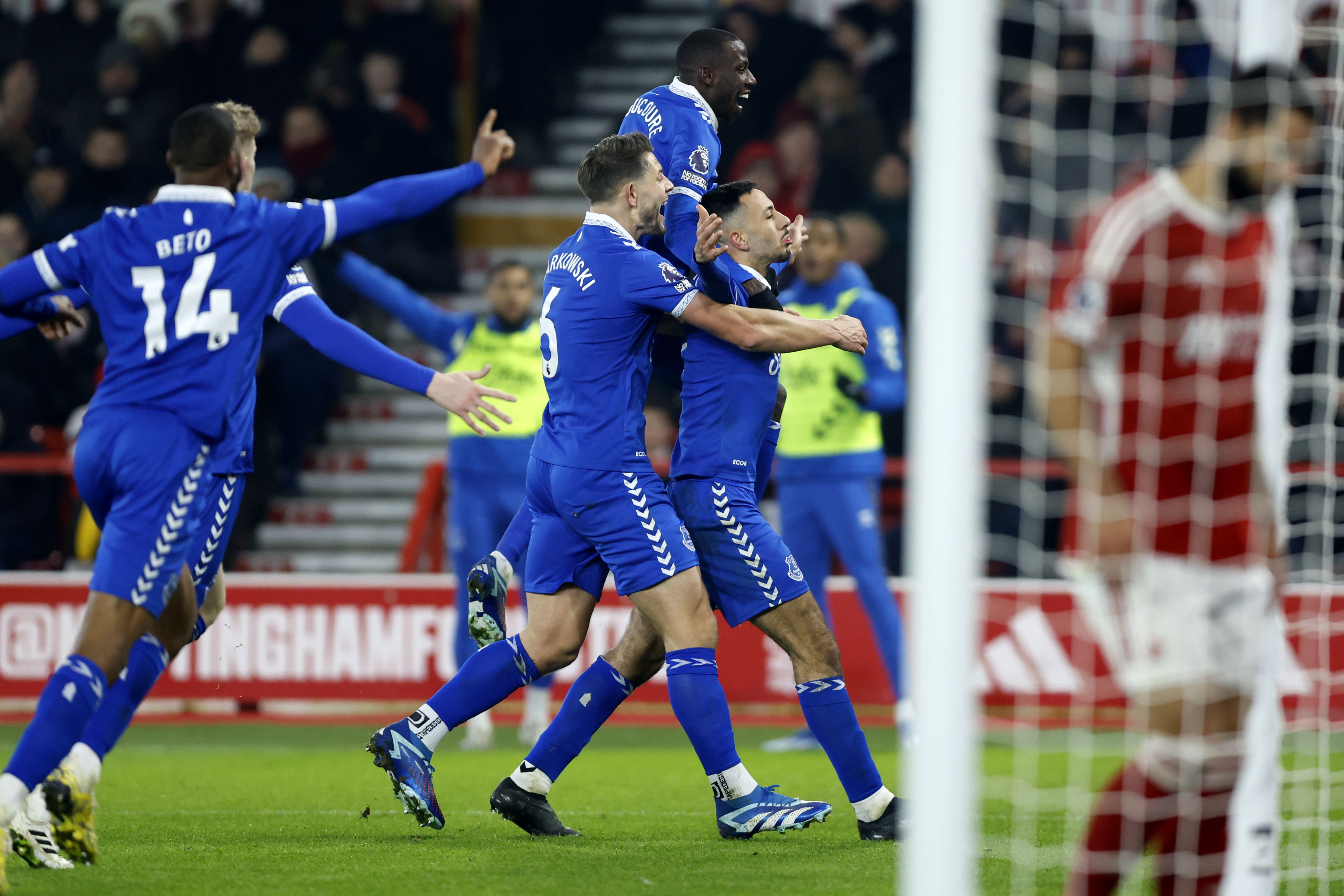 Dwight McNeil, right, celebrates with team-mates after scoring Everton’s winner (Nigel French/PA)