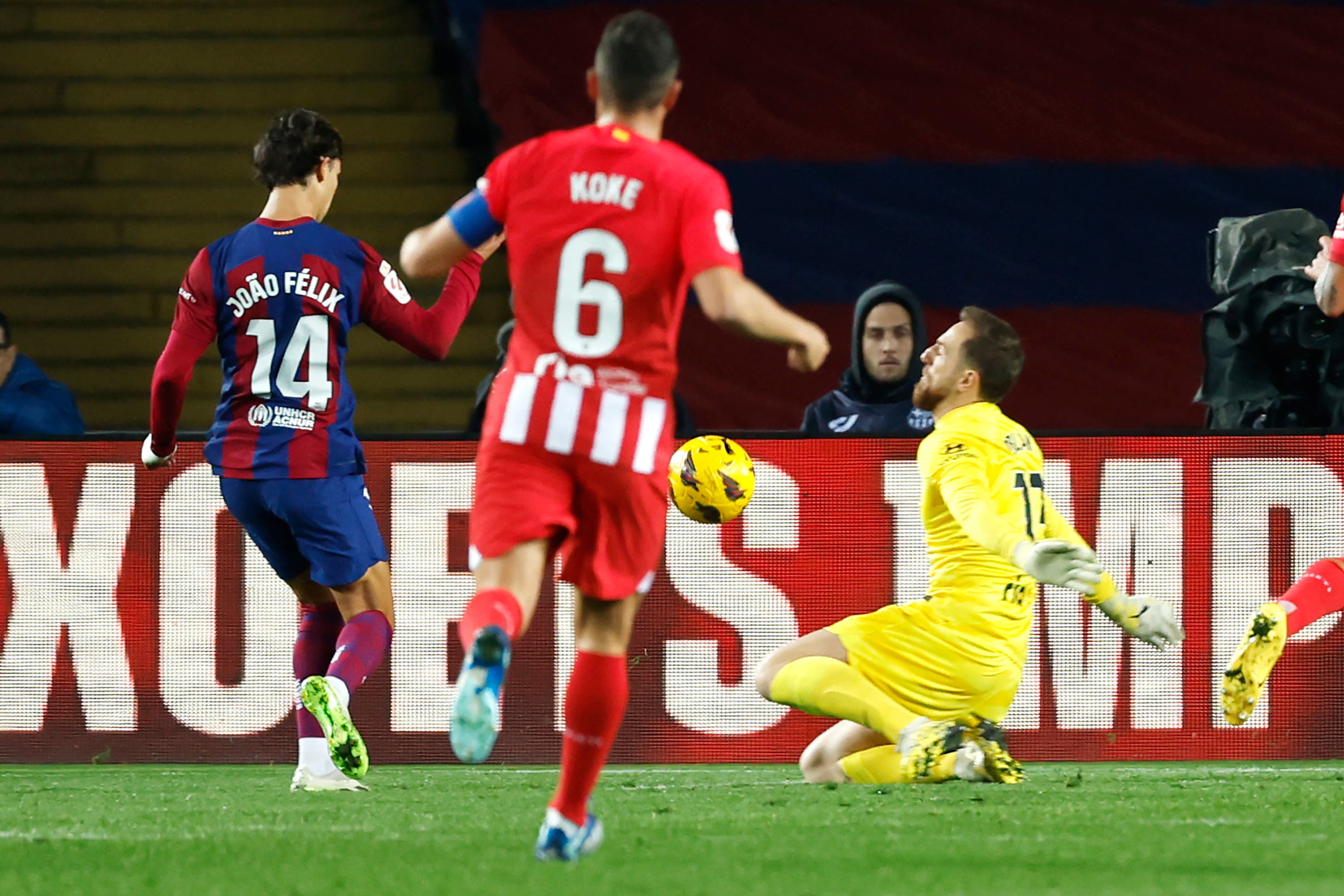 Joao Felix (left) scores for Barcelona against Atletico Madrid (Joan Monfort/AP)