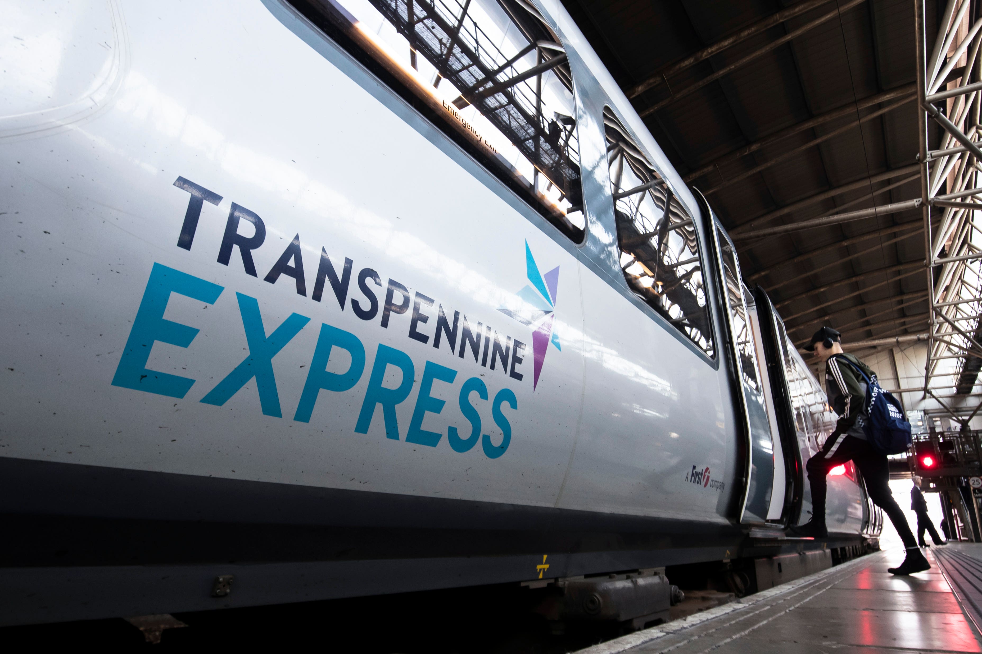 A TransPennine Express train at Leeds train station (PA)