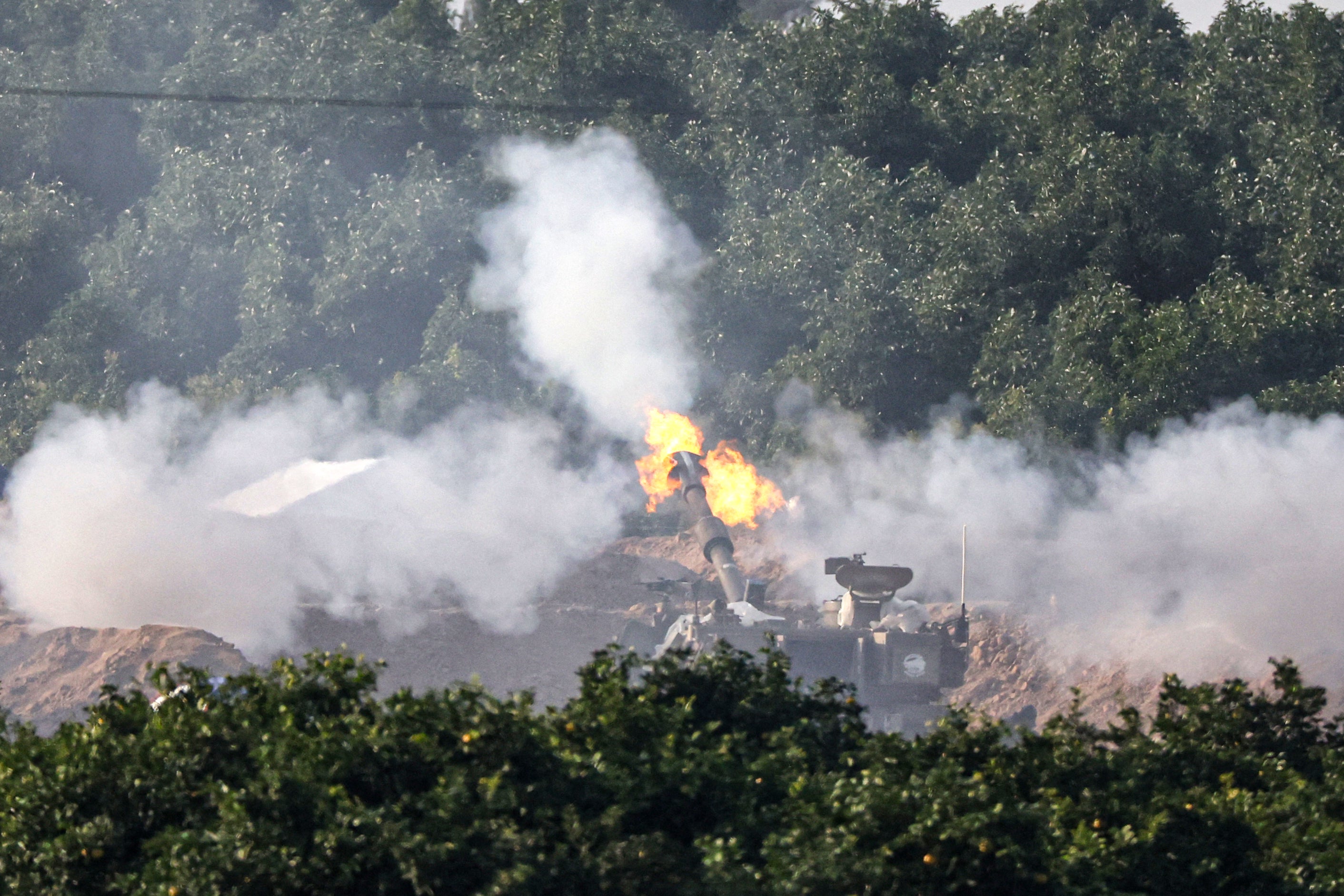 A tank in southern Israel fires into the Gaza Strip