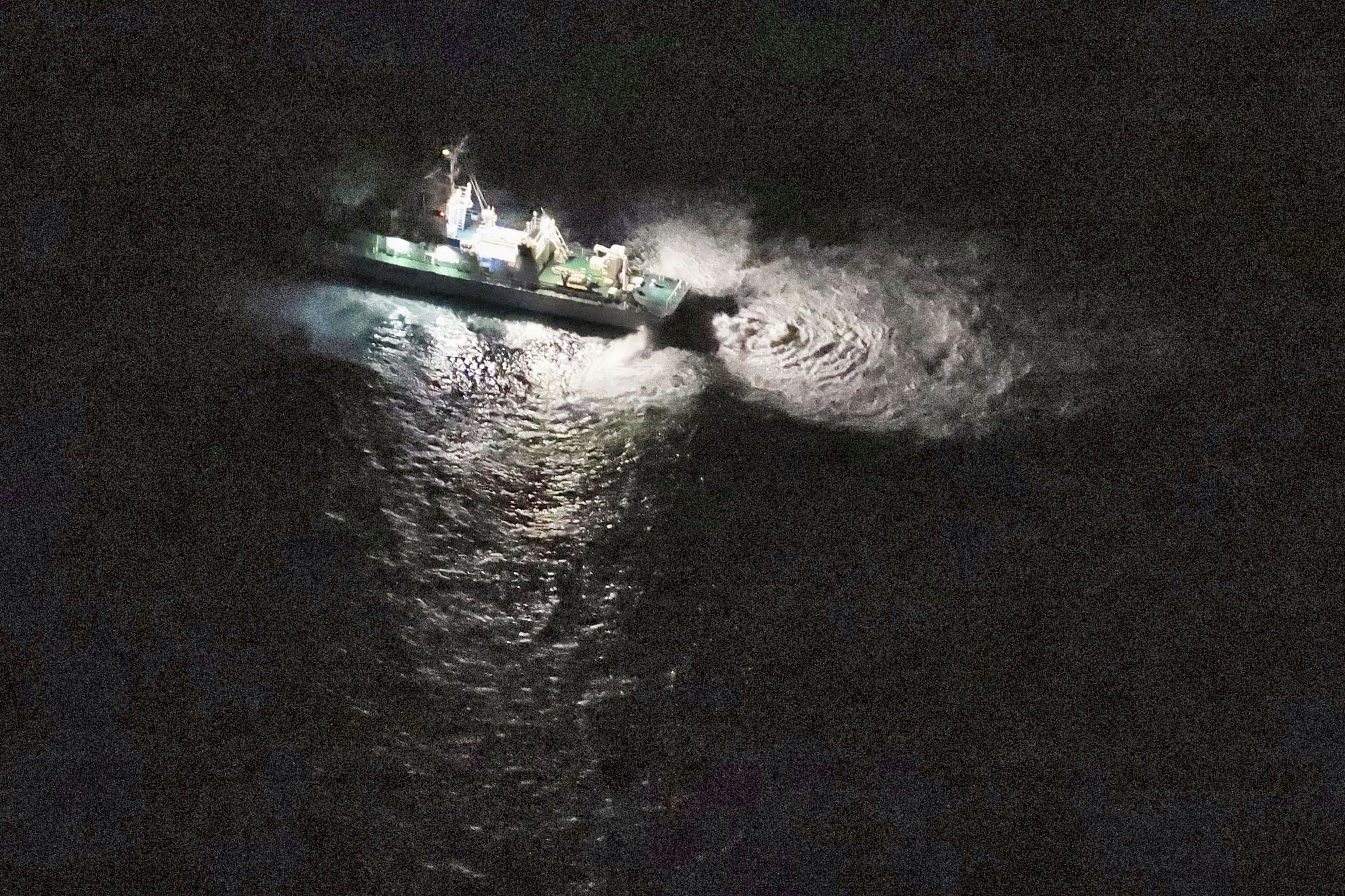 A Japan's coast guard vessel conducts search and rescue operation around the site where a U.S. military Osprey aircraft was believed to crash in the sea off Yakushima Island, Kagoshima prefecture, southern Japan Wednesday, Nov. 29, 2023