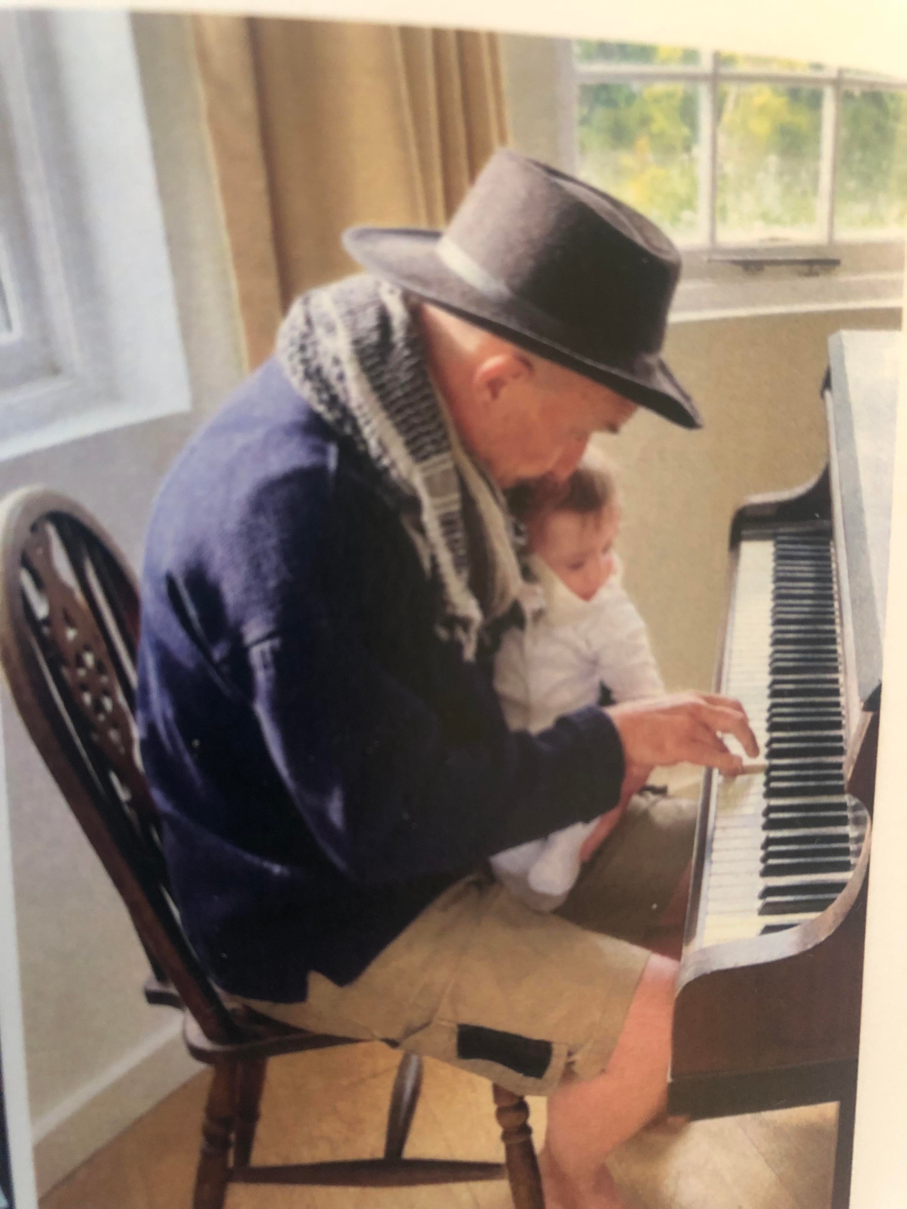 Kit teaching his grandson Ivo the piano at his Cornish home, summer 2022