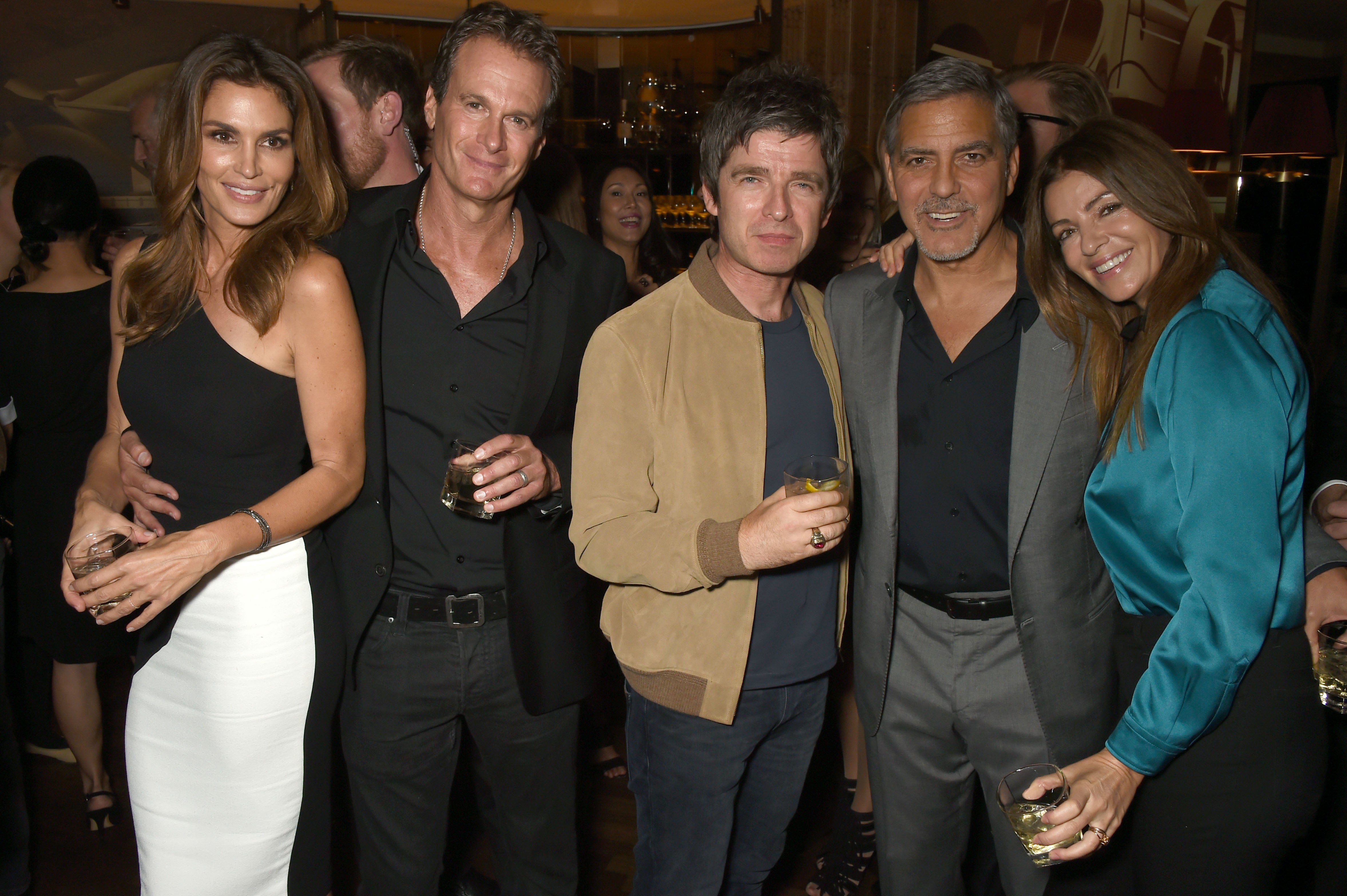 Noel Gallagher with his ex-wife Sara MacDonald (far right) in 2015, with George Clooney, Rande Gerber and Cindy Crawford