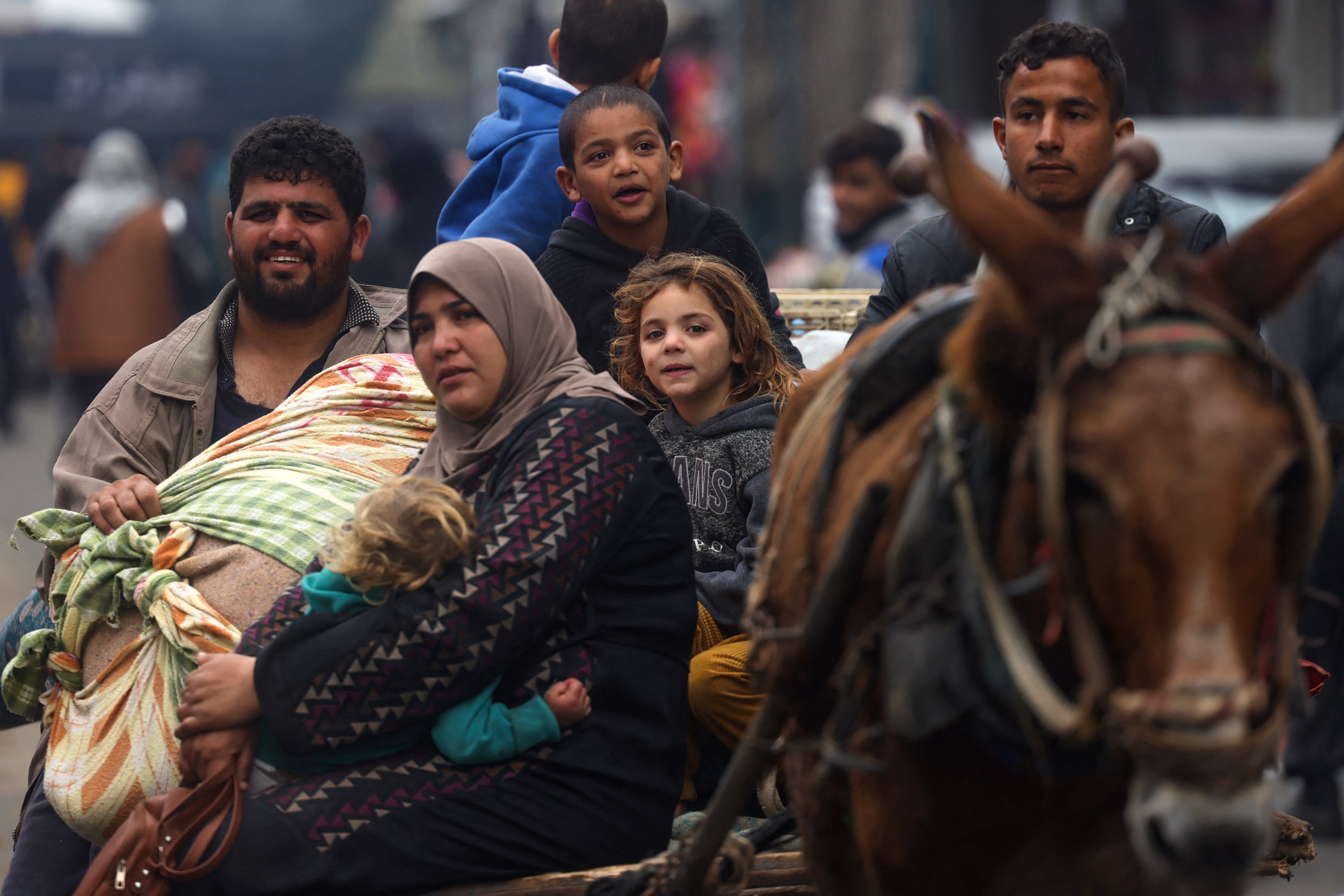 Palestinians fleeing Khan Younis arrive in Rafah, which lies further south