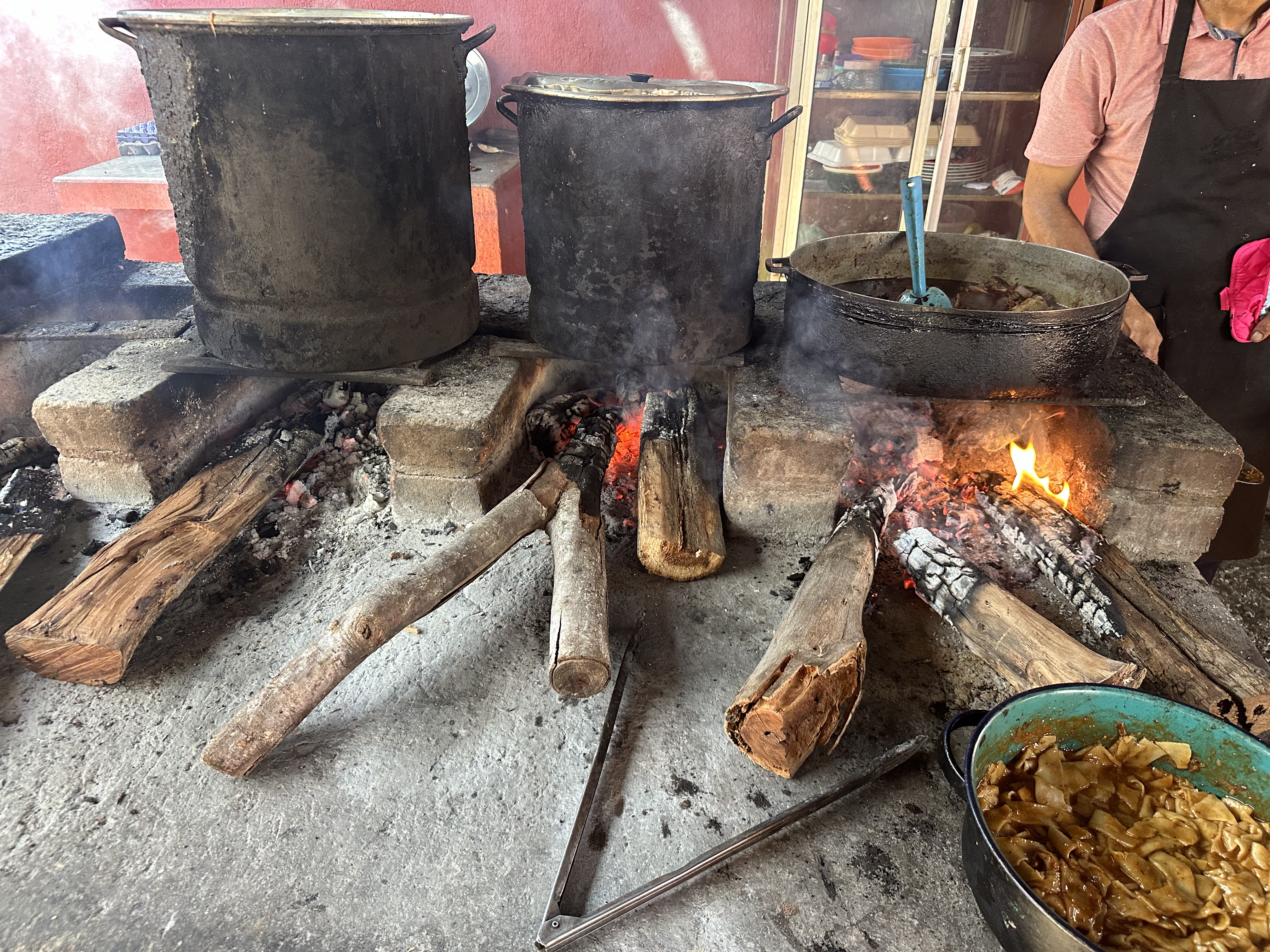 Food is slow-cooked over a fire