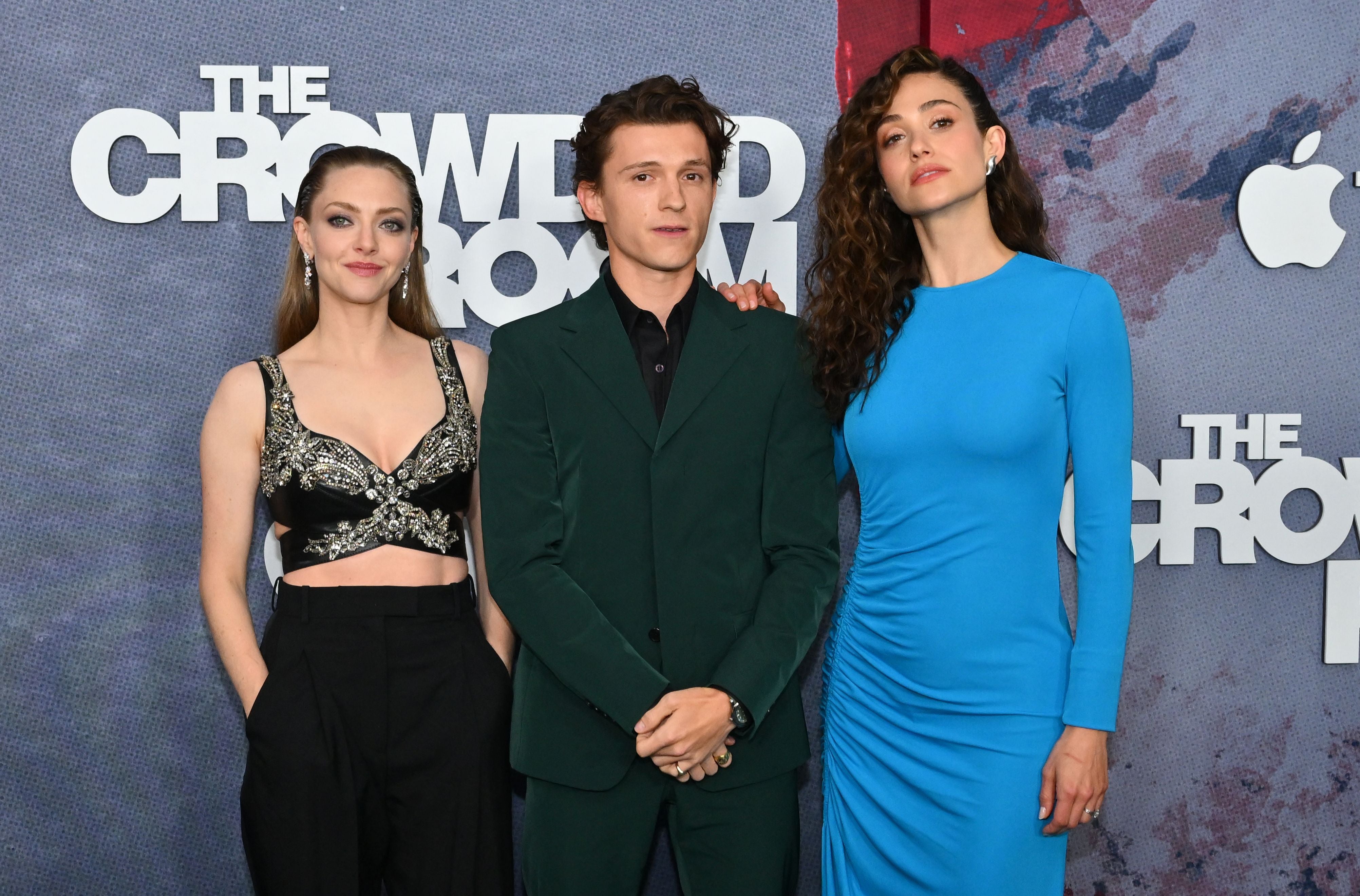 Actors Amanda Seyfried (L), Tom Holland (C) and Emmy Rossum (R)