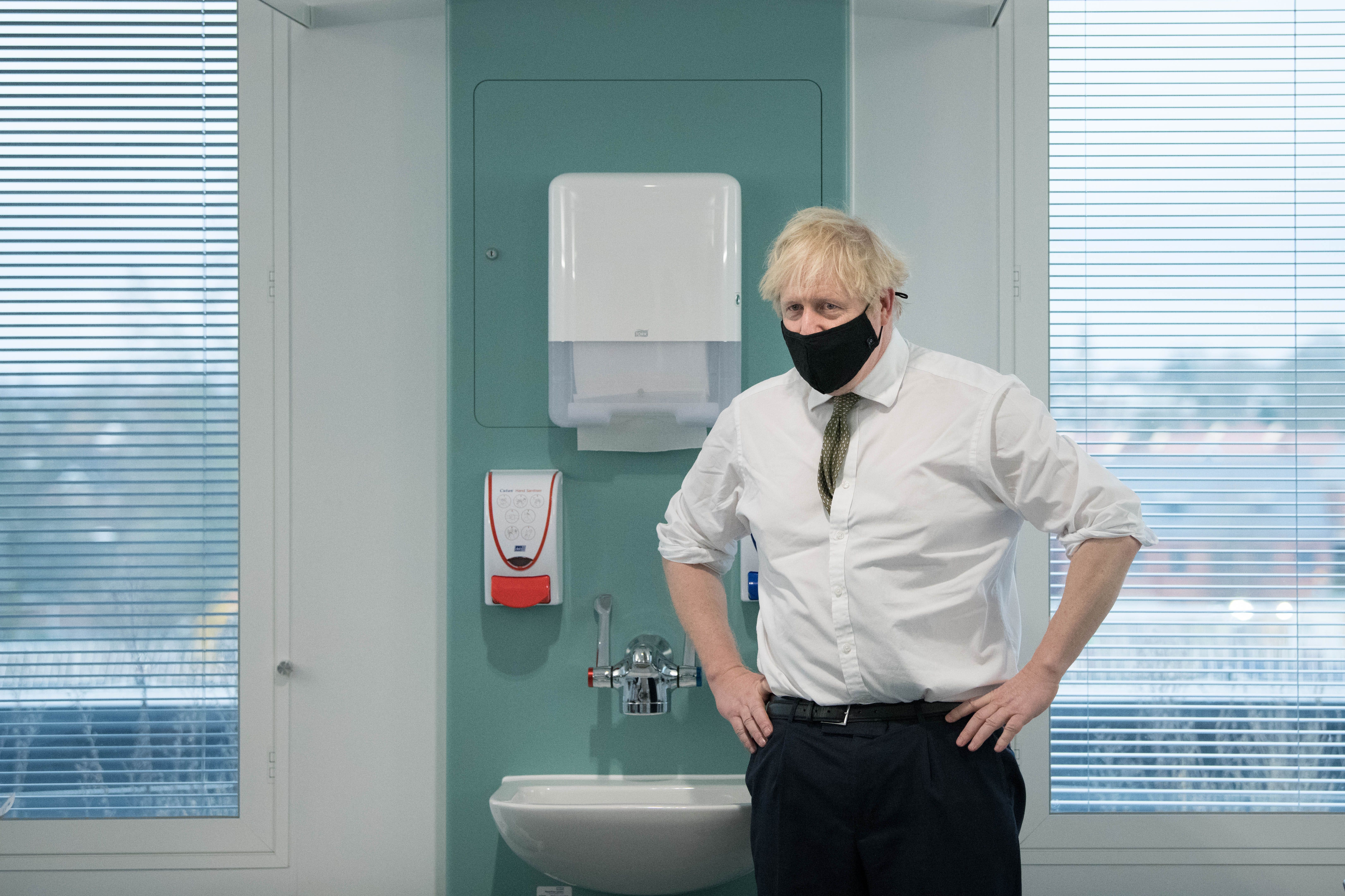 Boris Johnson during a visit to a hospital during the pandemic (Stefan Rousseau/PA)