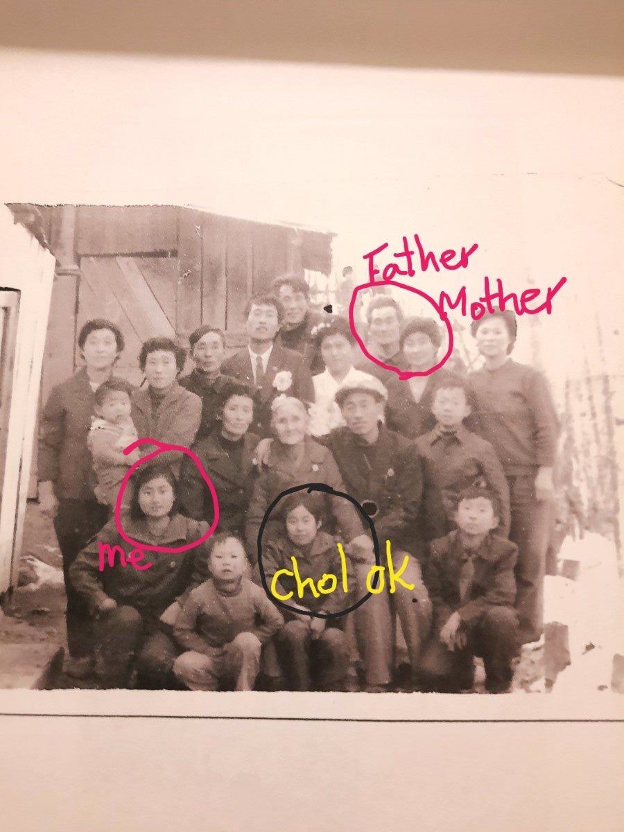 A photo from the early 1990s shows the family of Kim Kyu and her now missing sister, Kim Cheol-ok