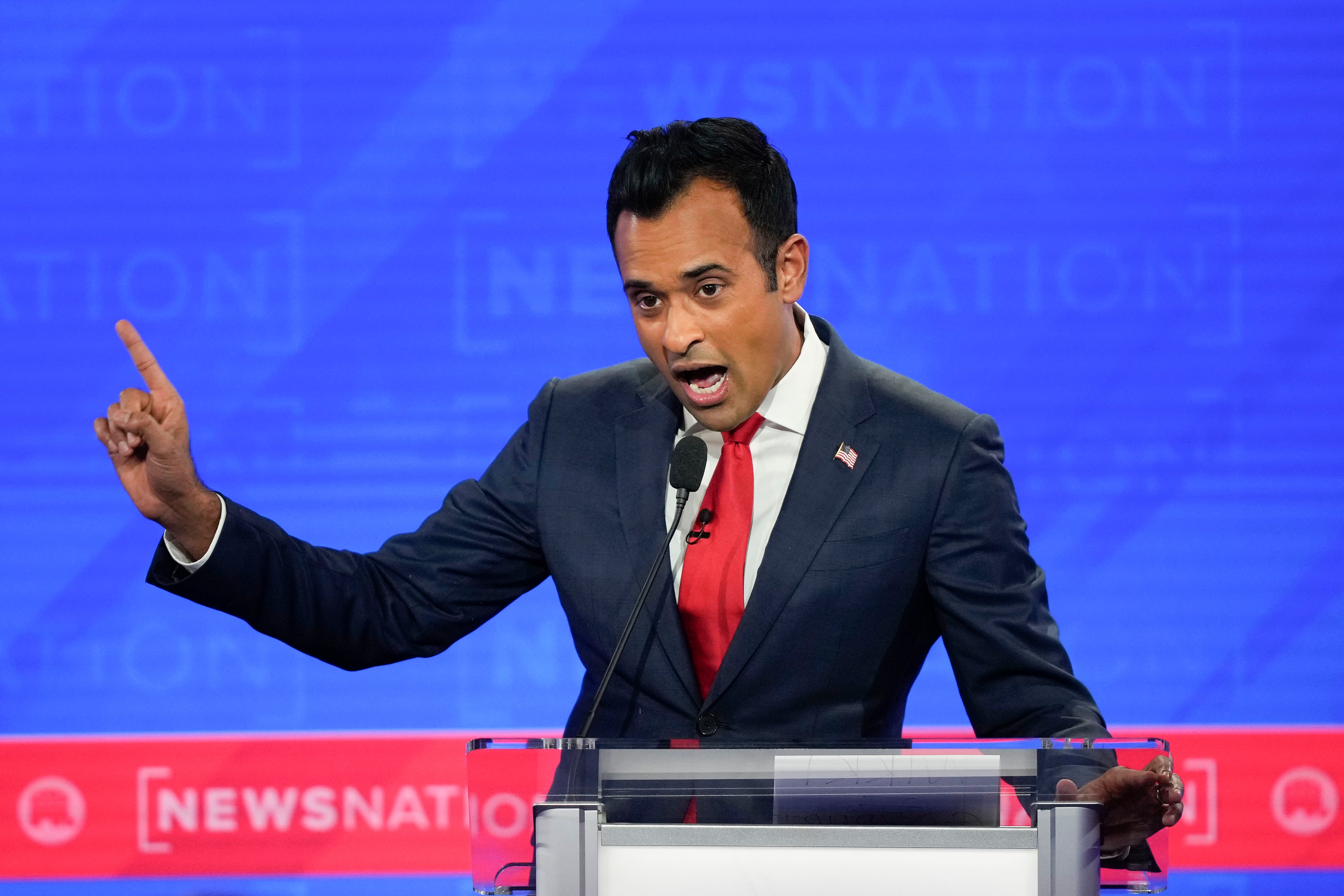 Republican presidential candidate businessman Vivek Ramaswamy gesturing during an exchange with former New Jersey Gov Chris Christie