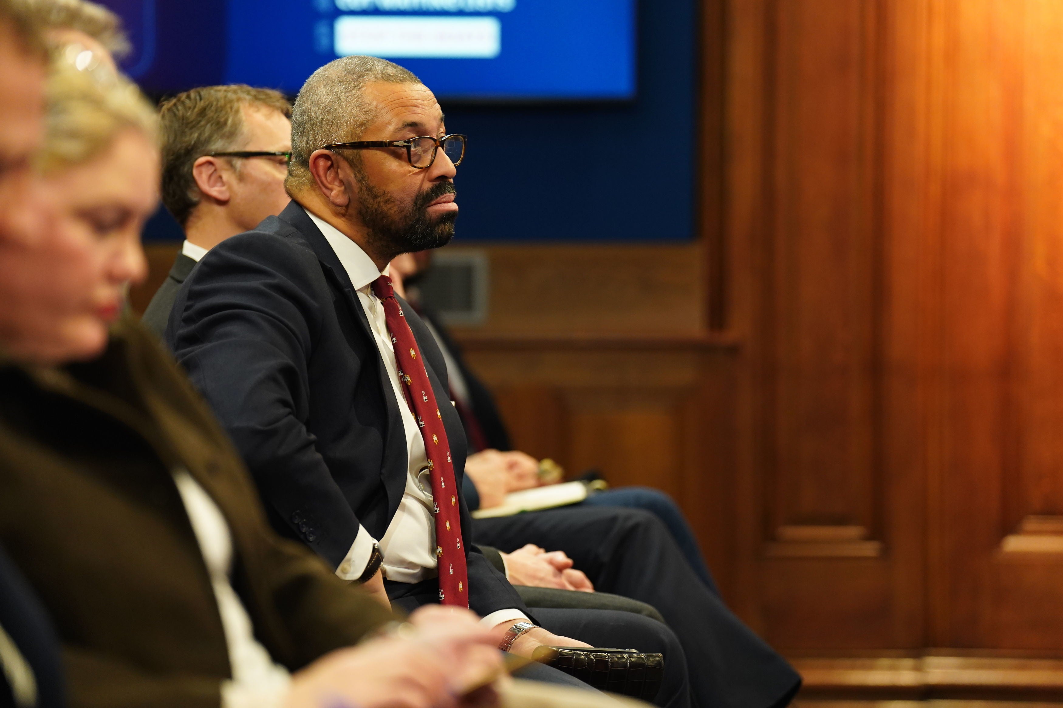 Home secretary James Cleverly watching Sunak’s press conference