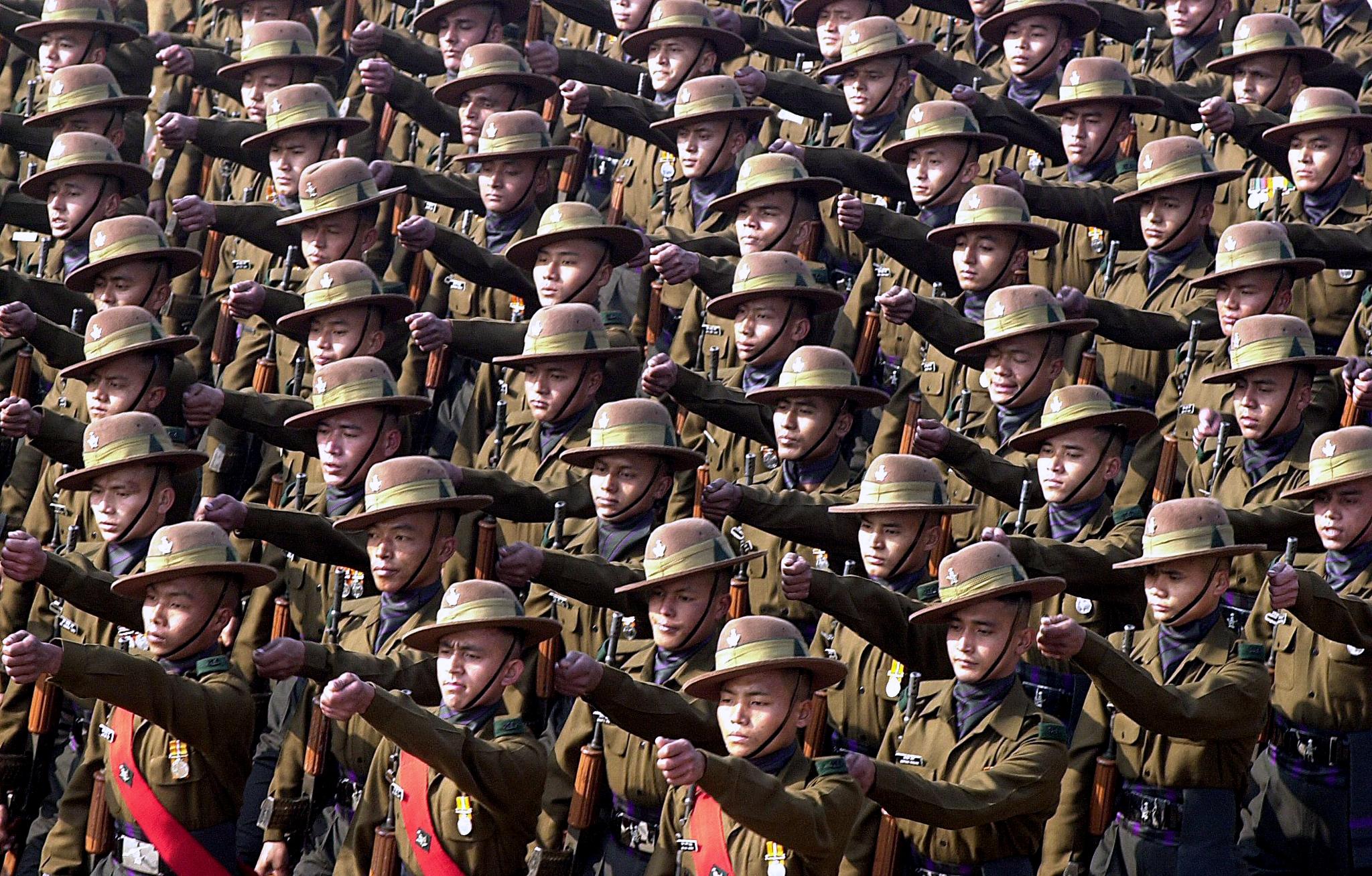 Indian army soldiers belonging to the Gurkha regiment march during the full dress rehearsal in New Delhi, 23 January 2001