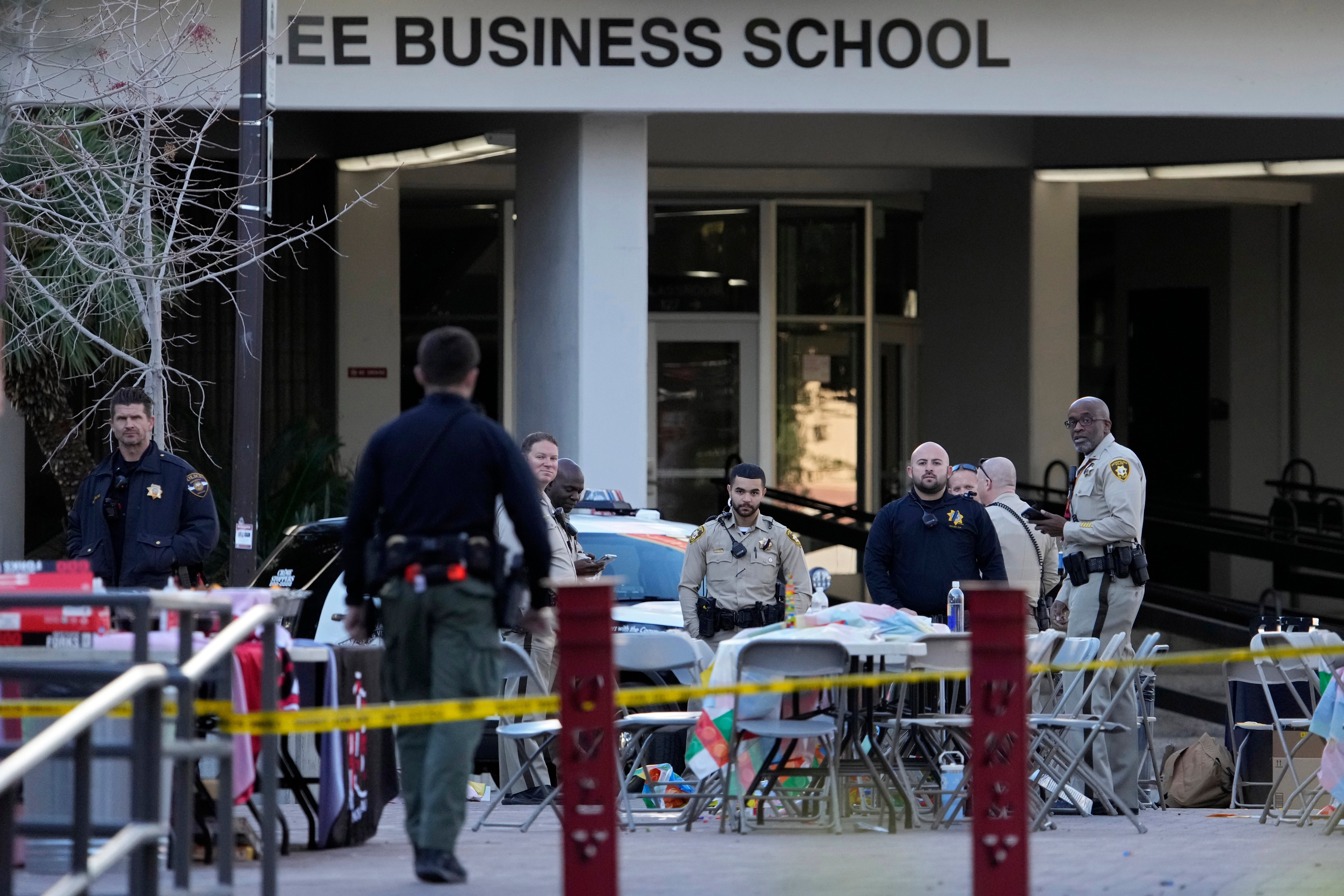 Las Vegas police stand near the scene of a shooting at the University of Nevada