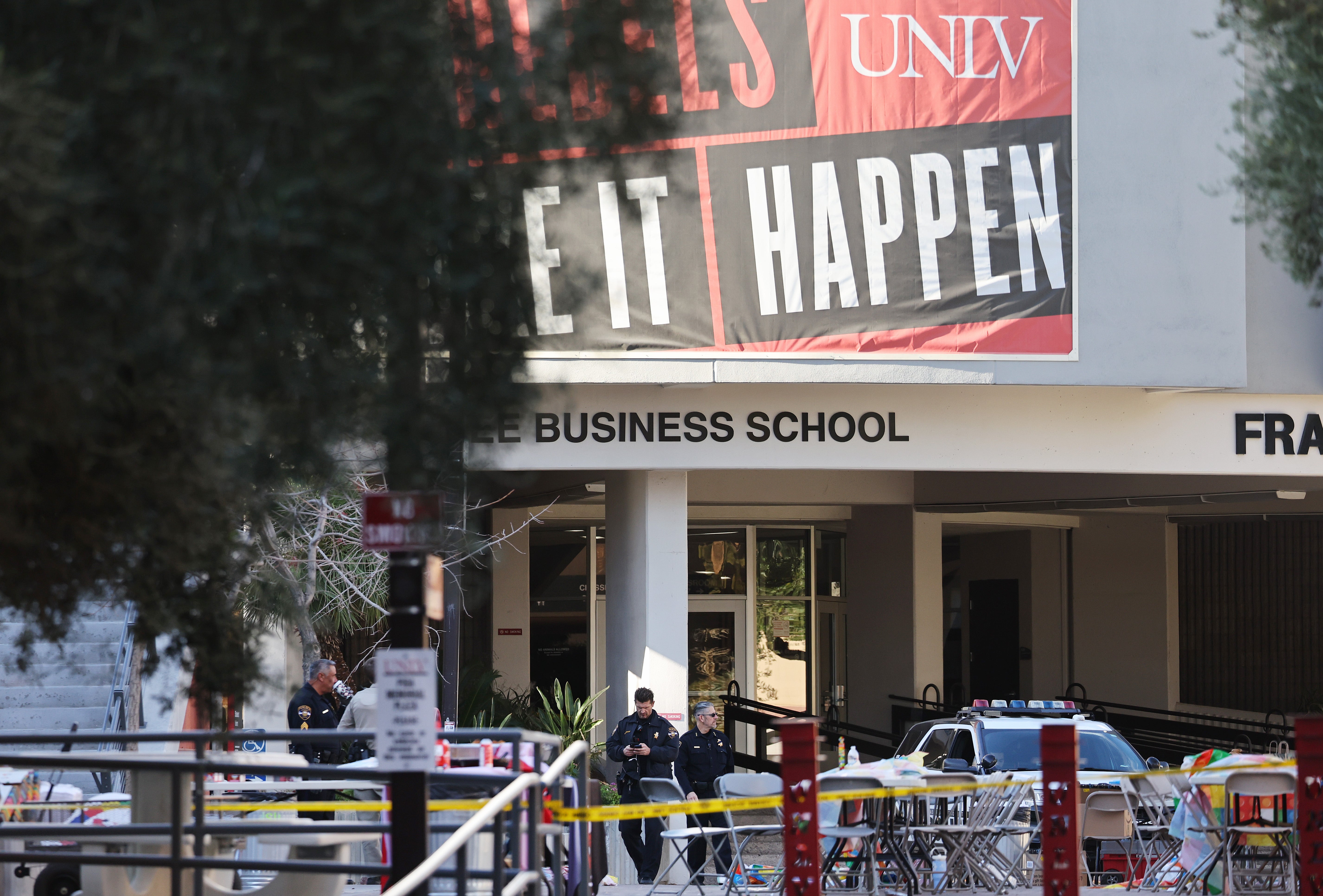 Police officers keep watch near the scene outside Frank and Estella Beam Hall, where the UNLV Lee Business School is located