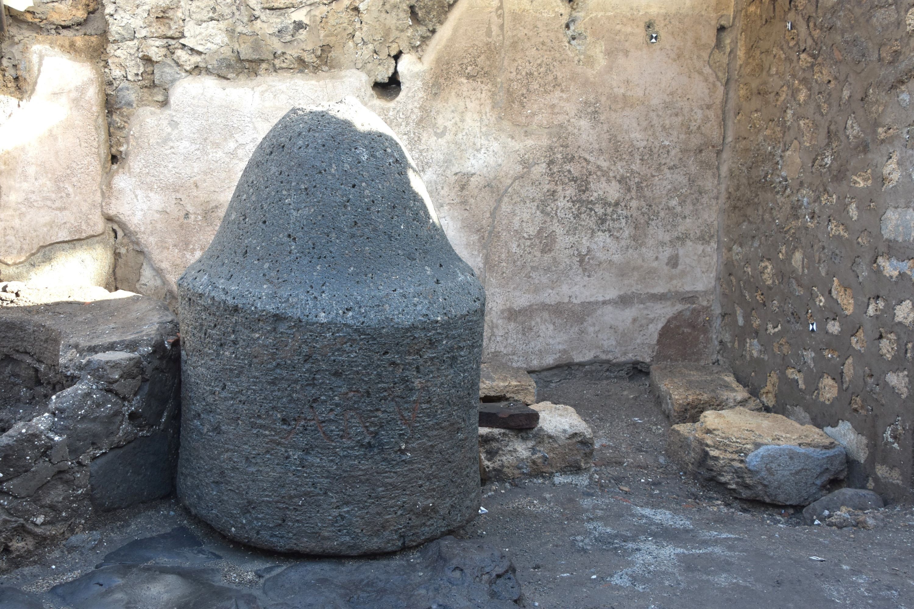 A view shows the interior of a “bakery-prison” where slaves and donkeys were locked up to grind the grain needed to make bread