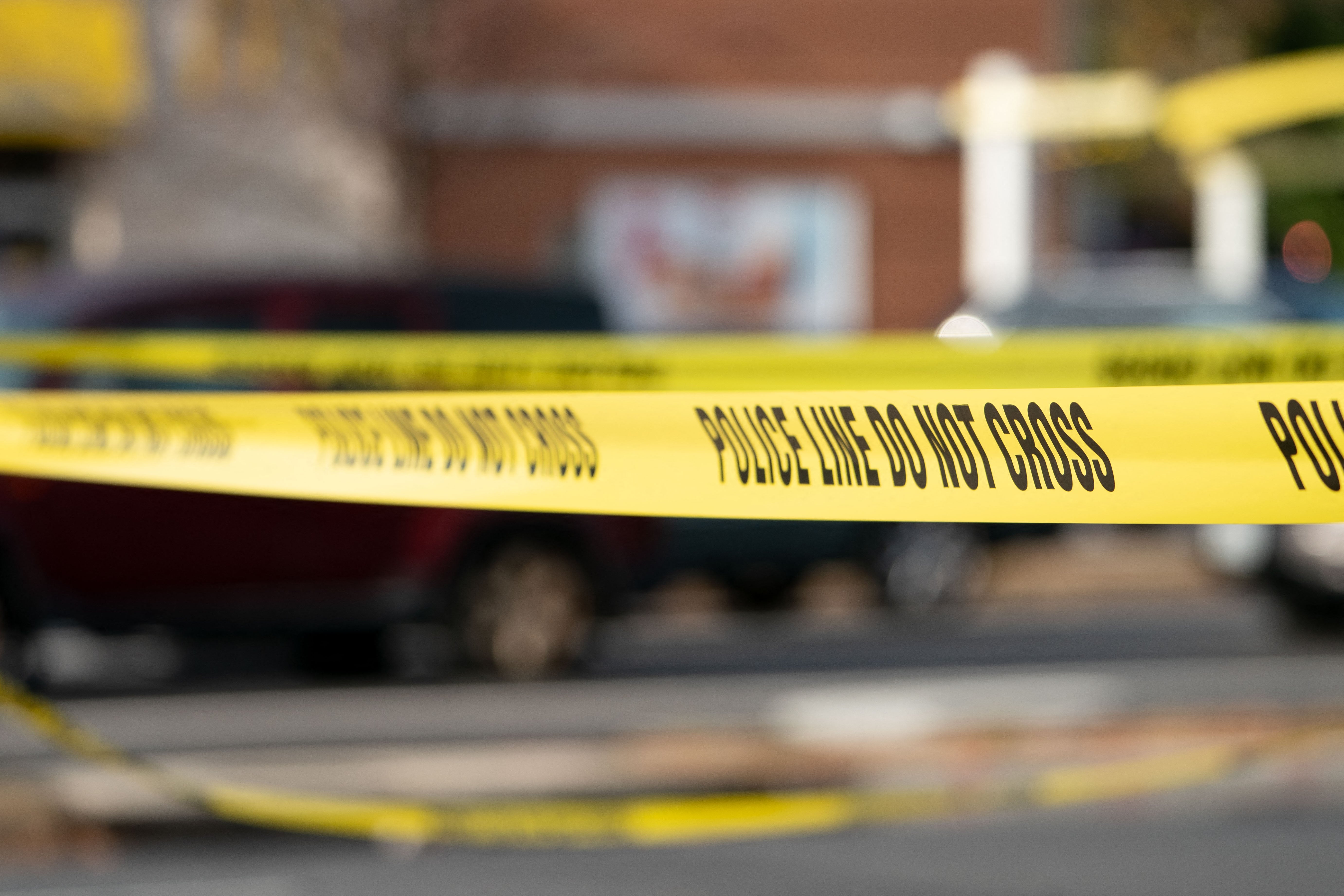 Yellow police tape blocking off a crime scene