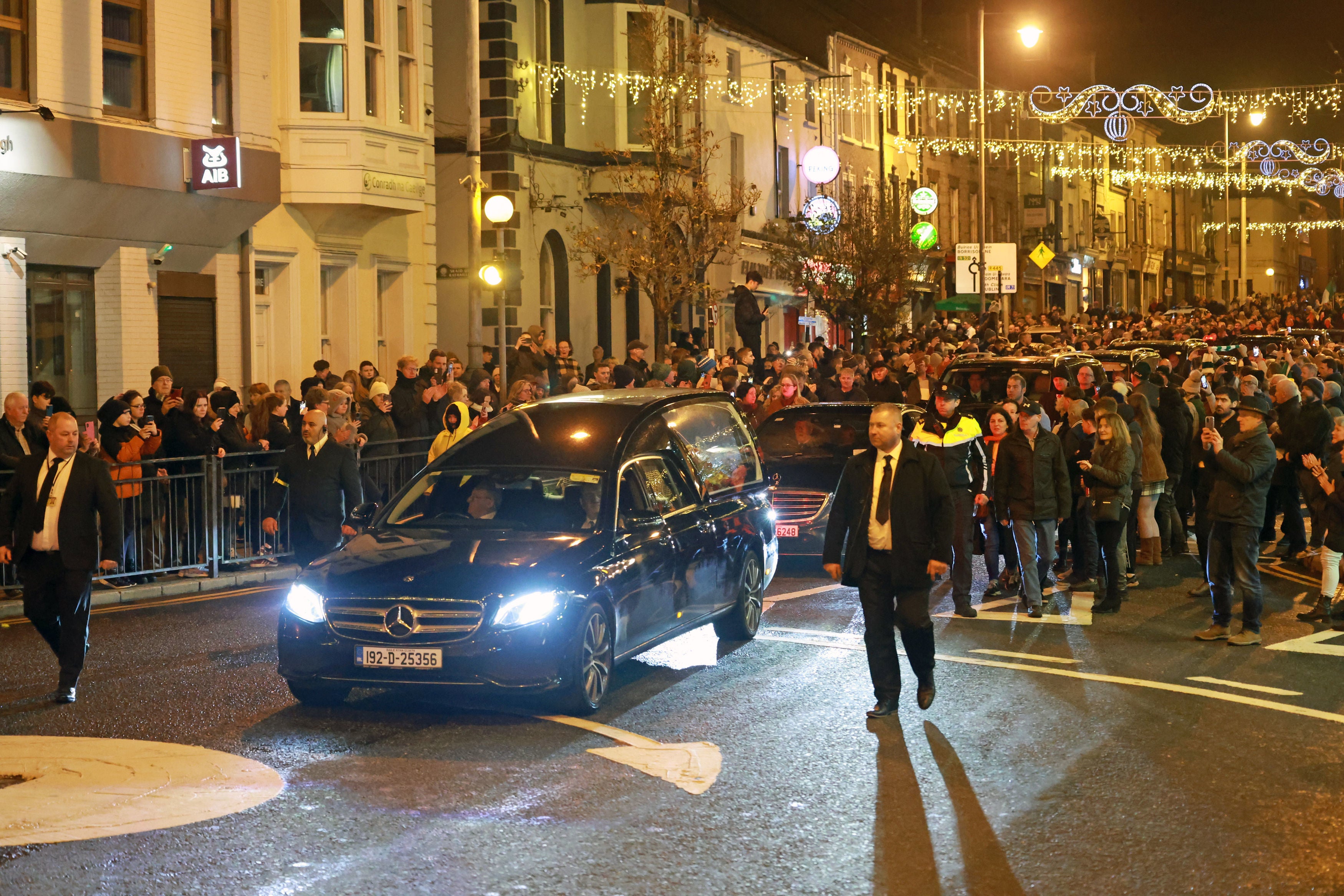 The hearse carrying the coffin of Shane MacGowan passes through Nenagh