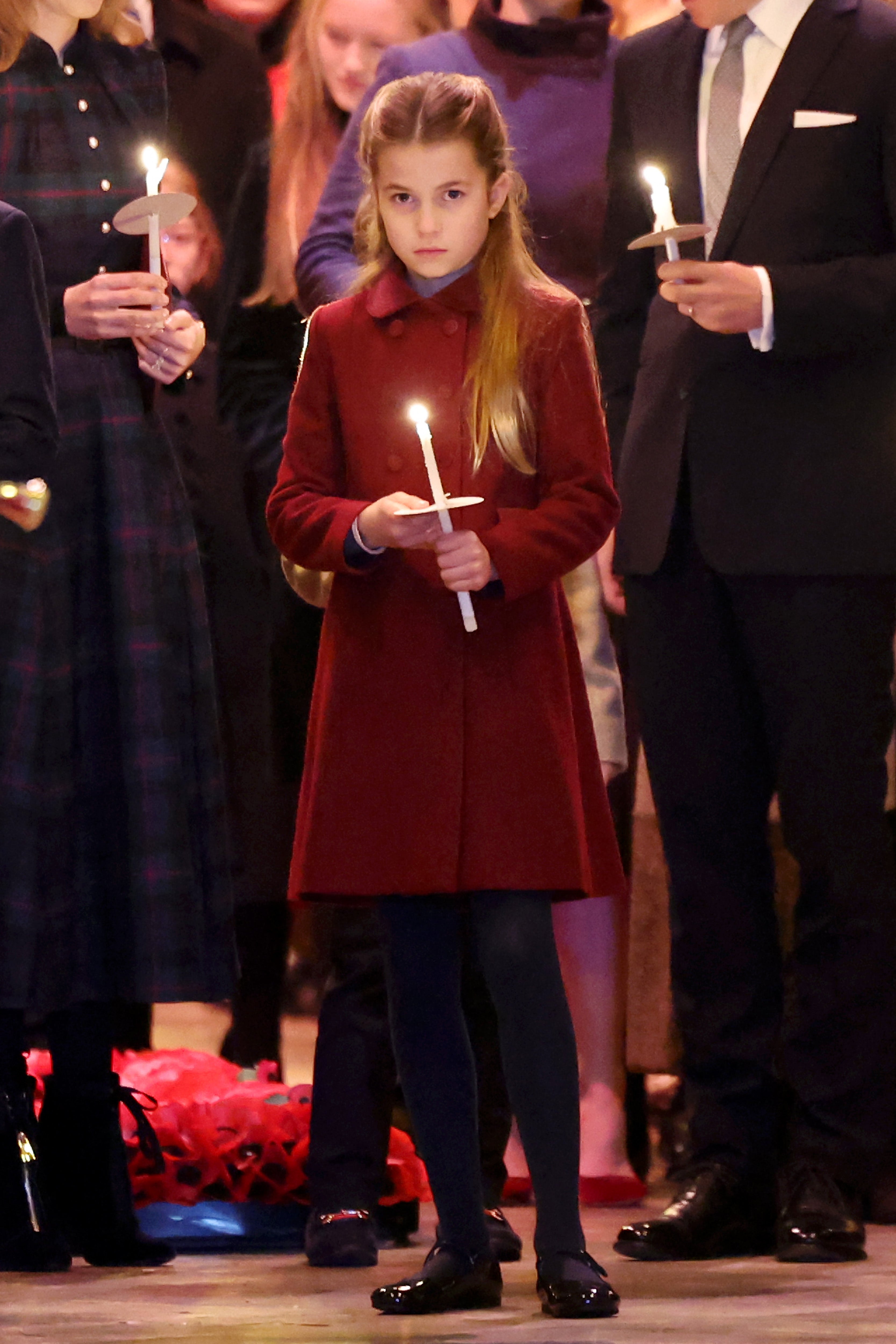 Princess Charlotte wears a cheerful red coat for the festive occasion