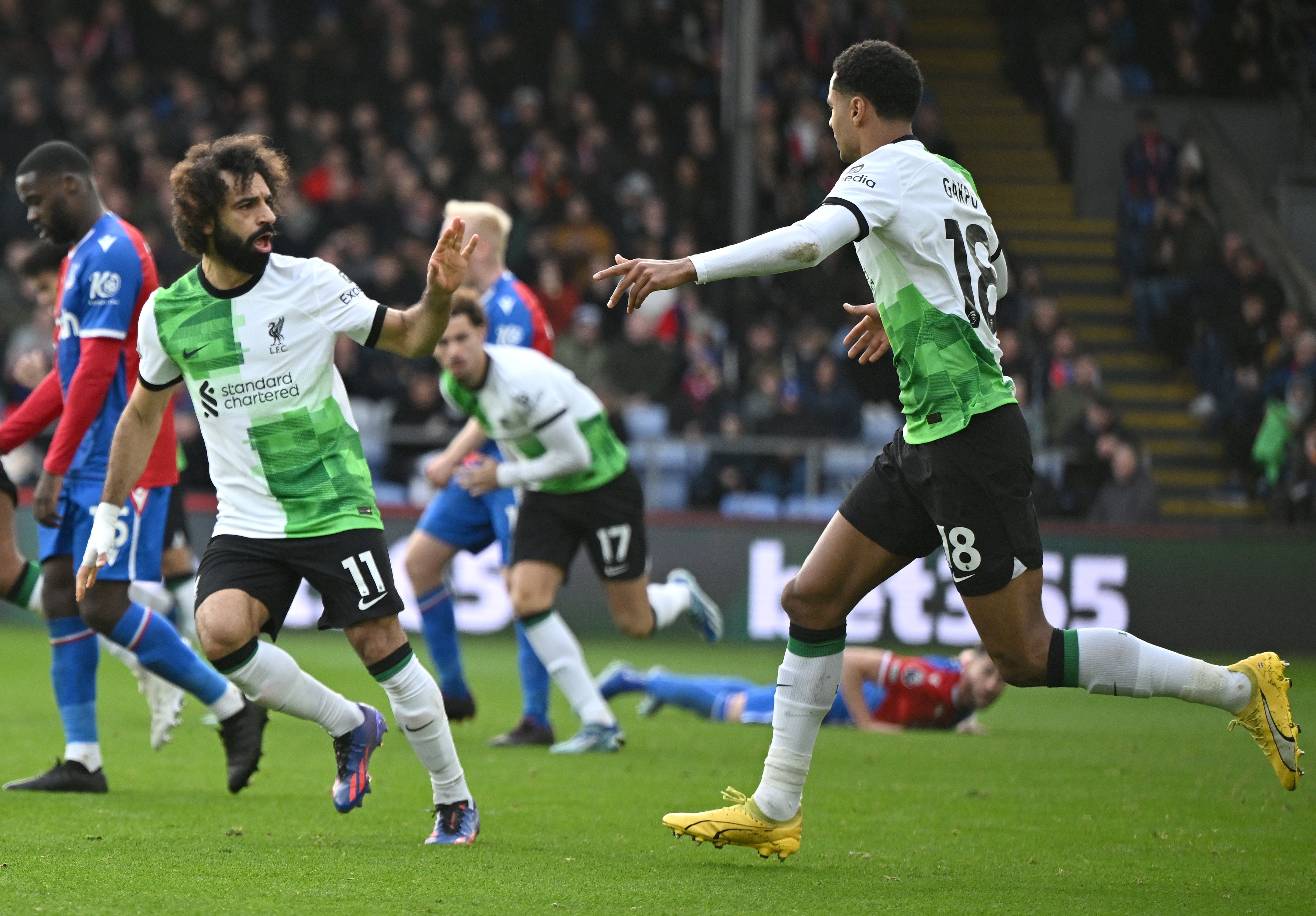 Mohamed Salah celebrates with Cody Gakpo after scoring Liverpool’s first goal