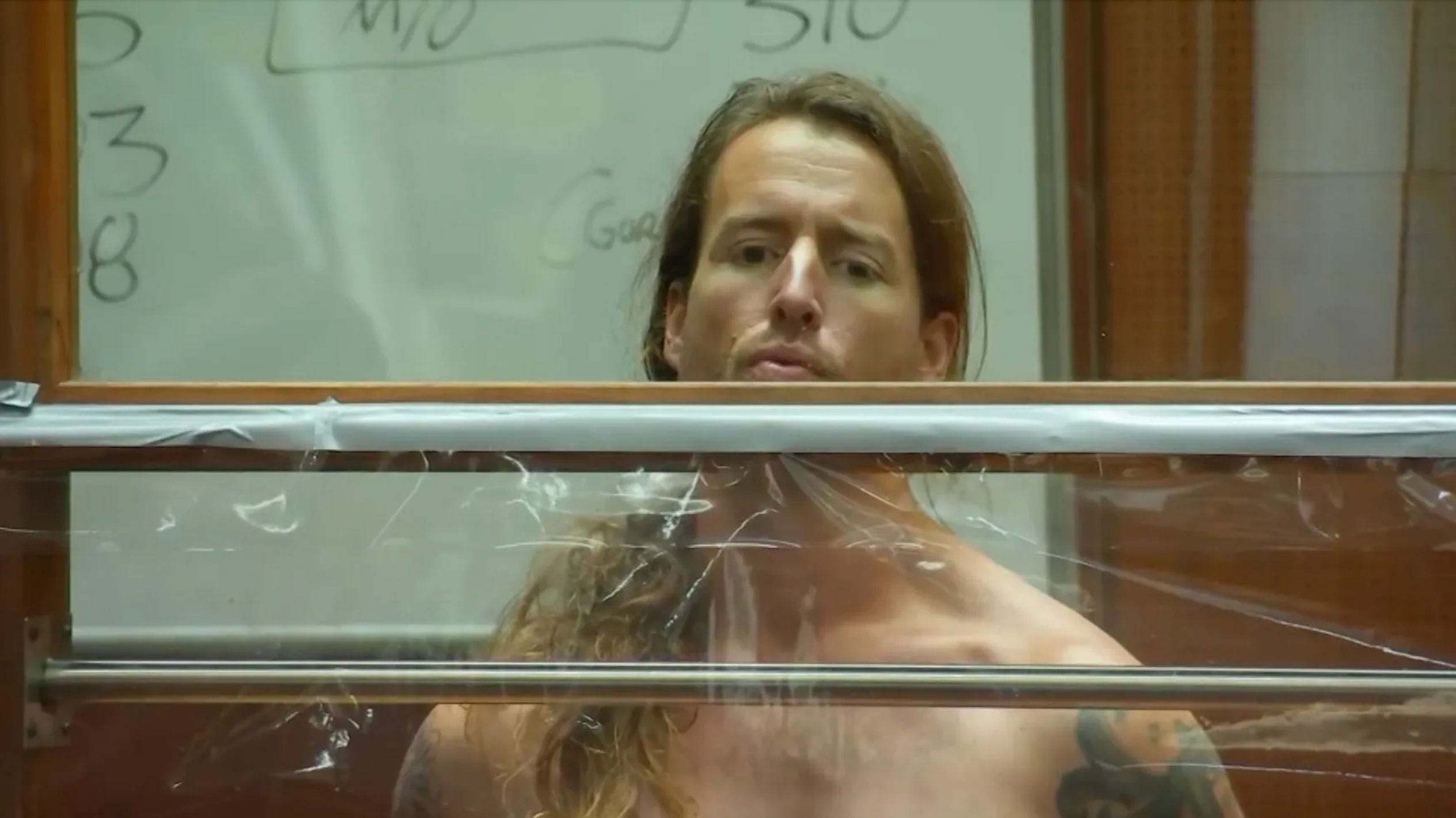 Samuel Haskell Jr stands shirtless in a Los Angeles County courtroom during a hearing on 8 December