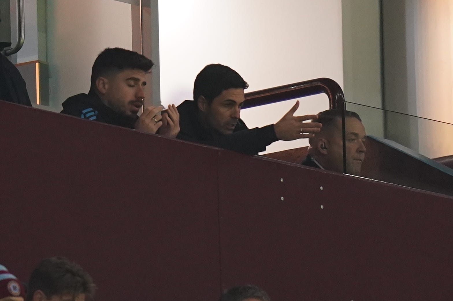 Arsenal manager Mikel Arteta (centre) watches from the stands at Villa Park (Jacob King/PA)