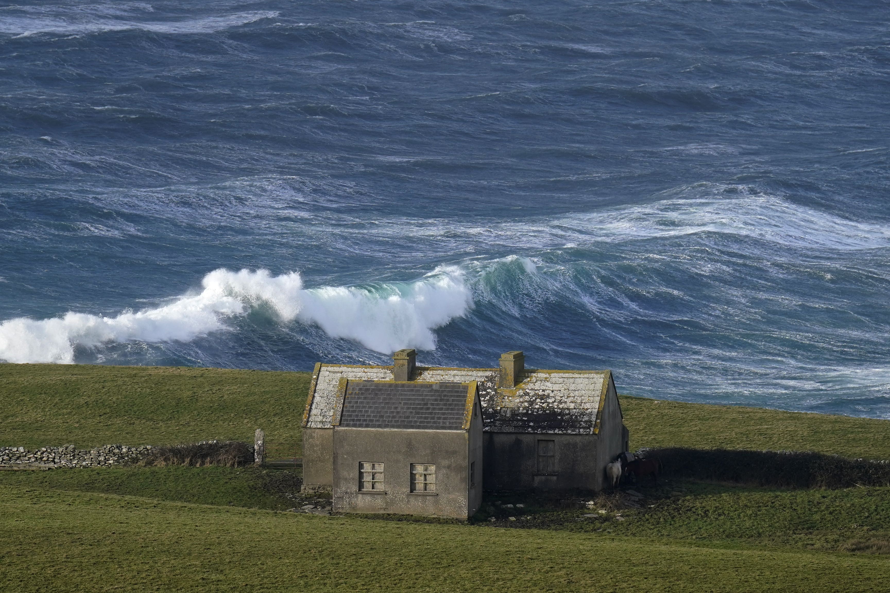 Waves crashing against the shore at Doolin in County Clare on the west coast of Ireland (Niall Carson/PA)