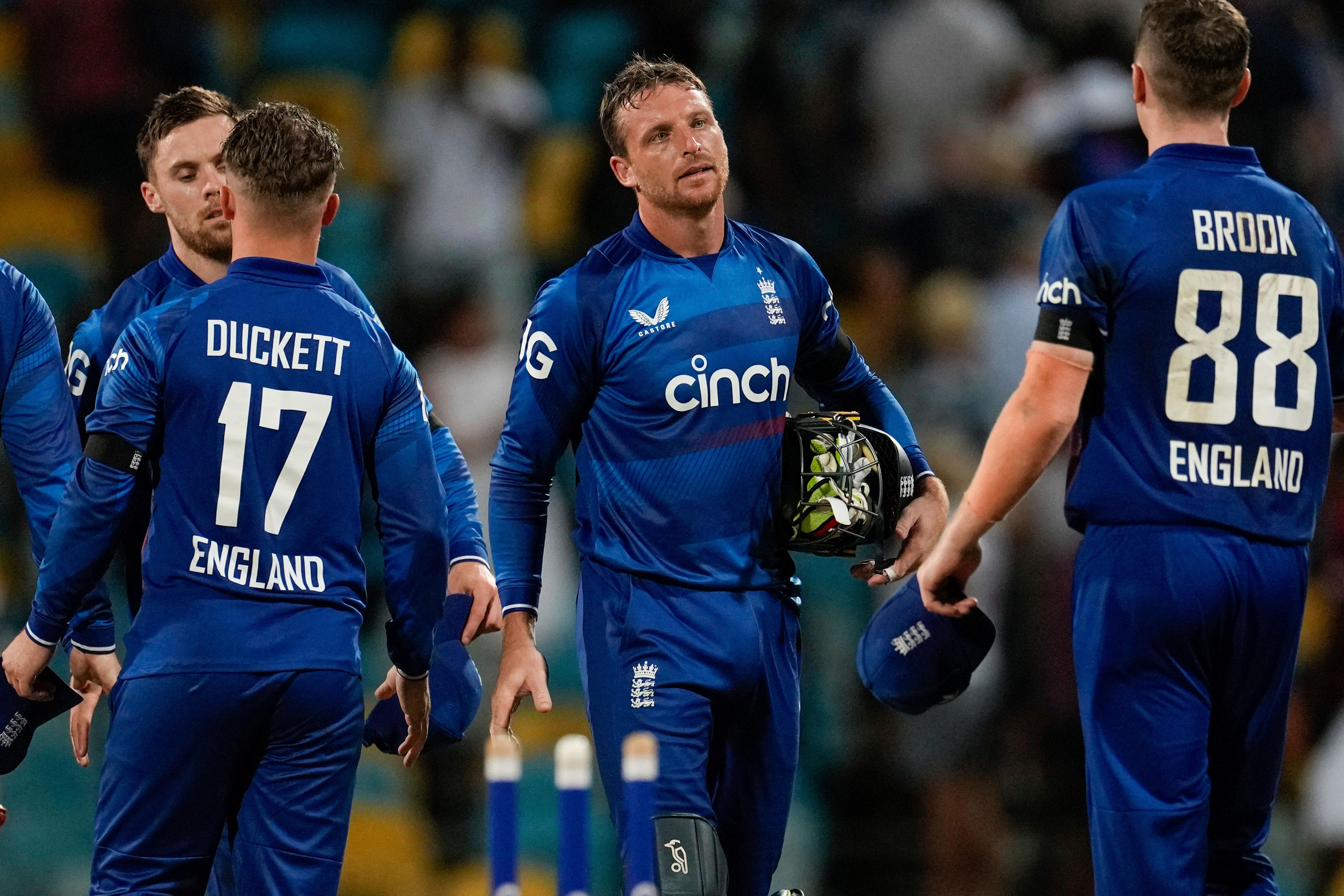 England’s captain Jos Buttler walks off at the end of his side’s loss against West Indies (Ricardo Mazalan/AP)