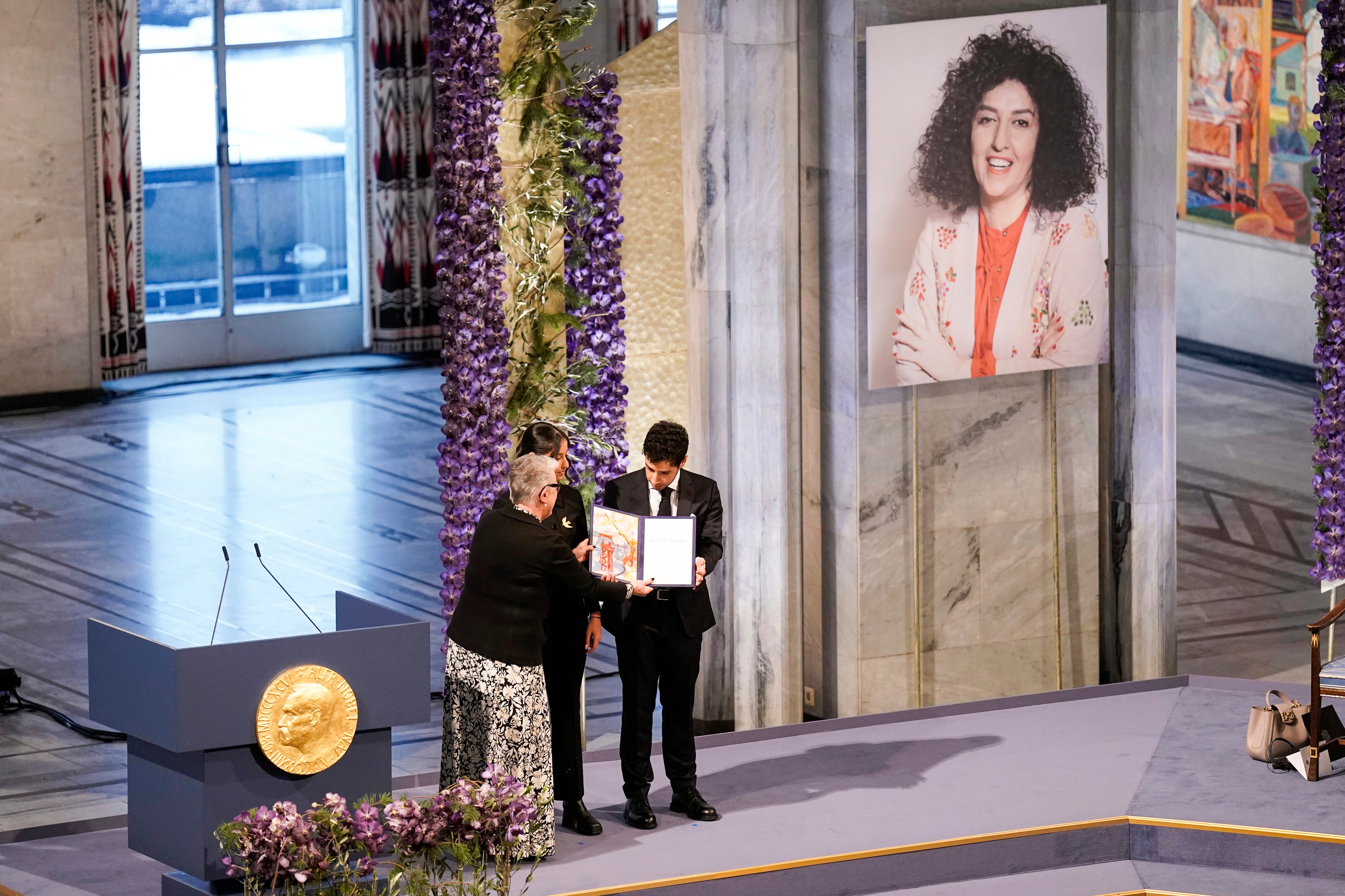 The two children being handed the prize