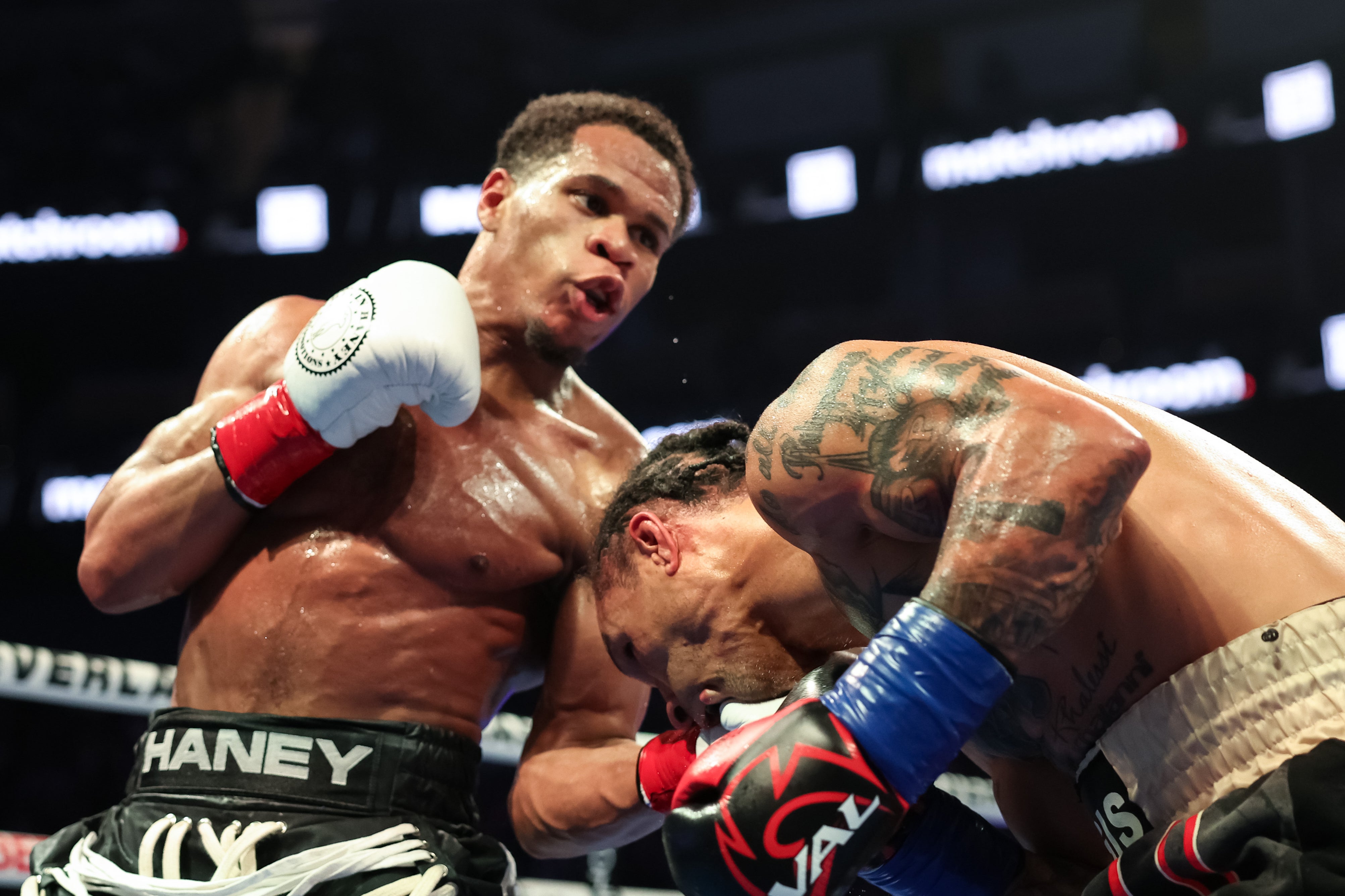 Haney (left) eased past Regis Prograis to become a two-weight world champion