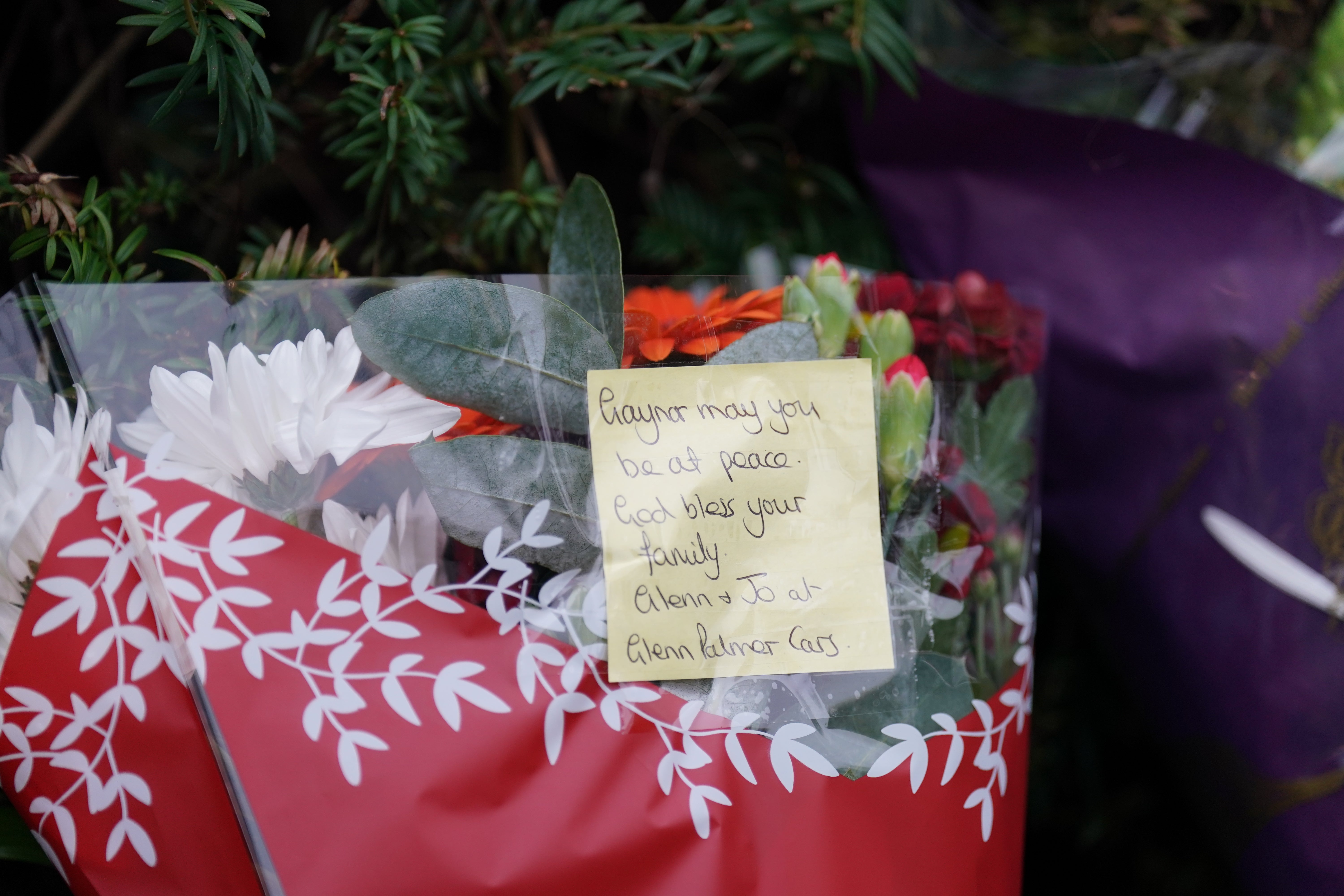 Floral tributes began to be laid near the gates of Wensum Park, with three bunches left by 3pm on Friday